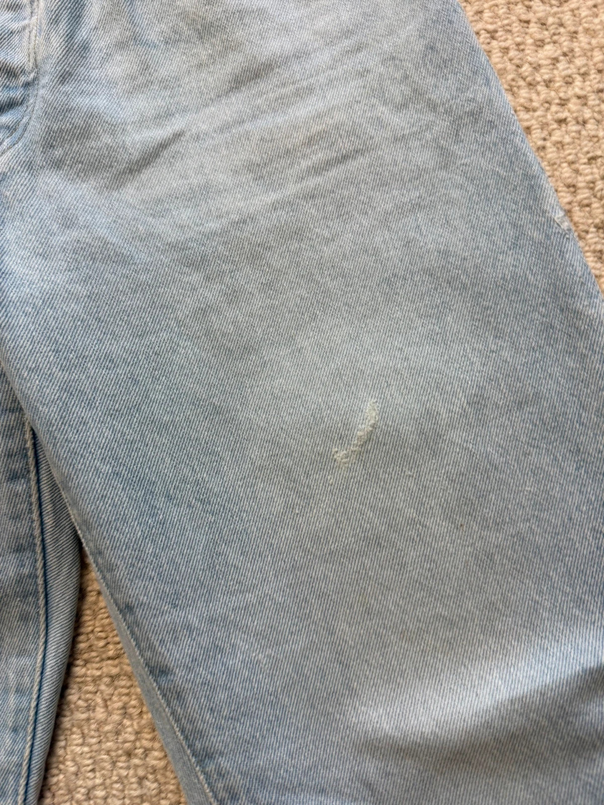 Levi's blue high rise straight jeans with button fly and premium label.