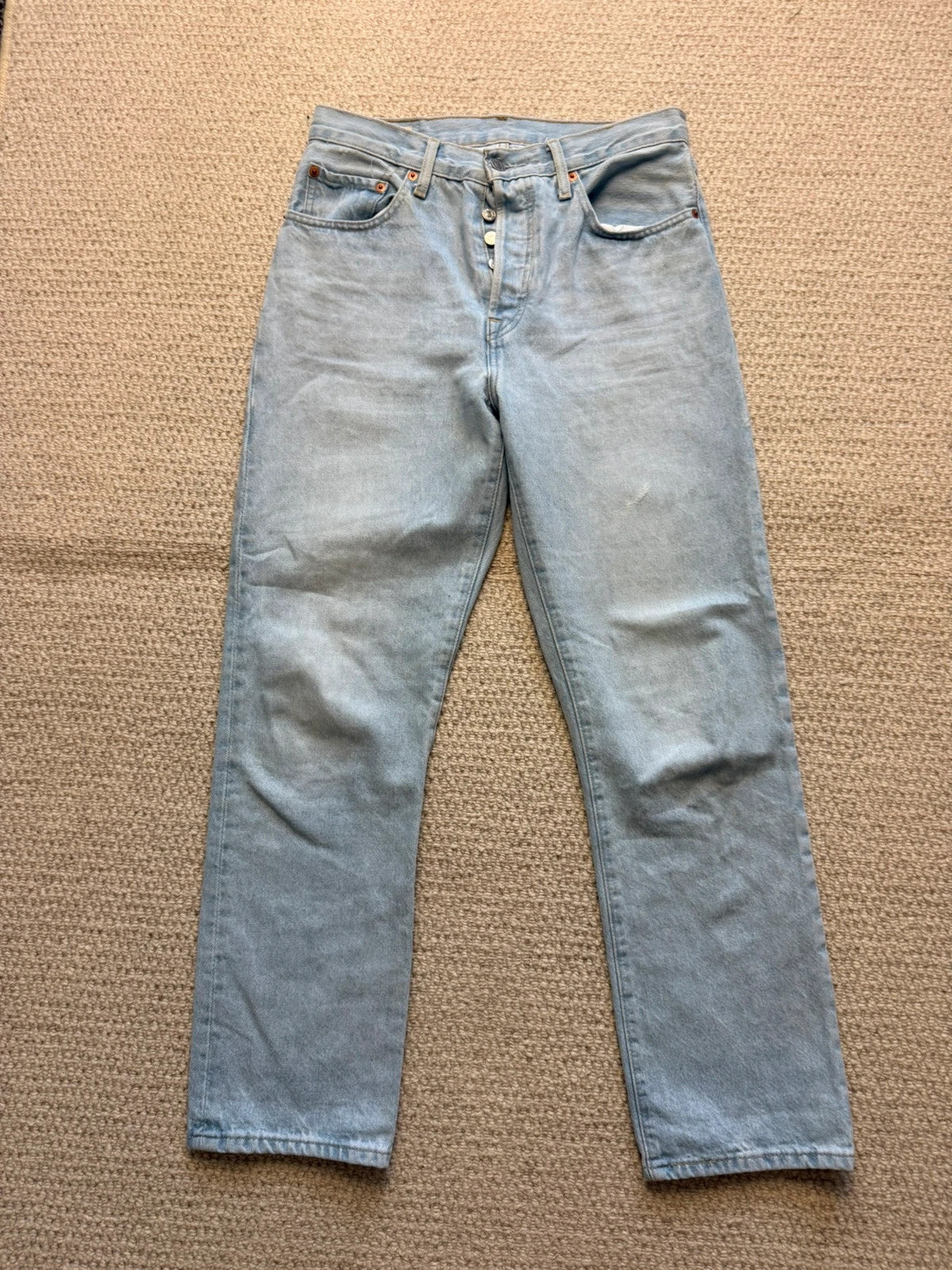 Levi's blue high rise straight jeans with button fly and premium label.