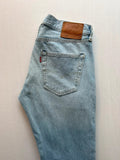 Levi's light blue straight jeans with button fly and signature back pocket stitching.
