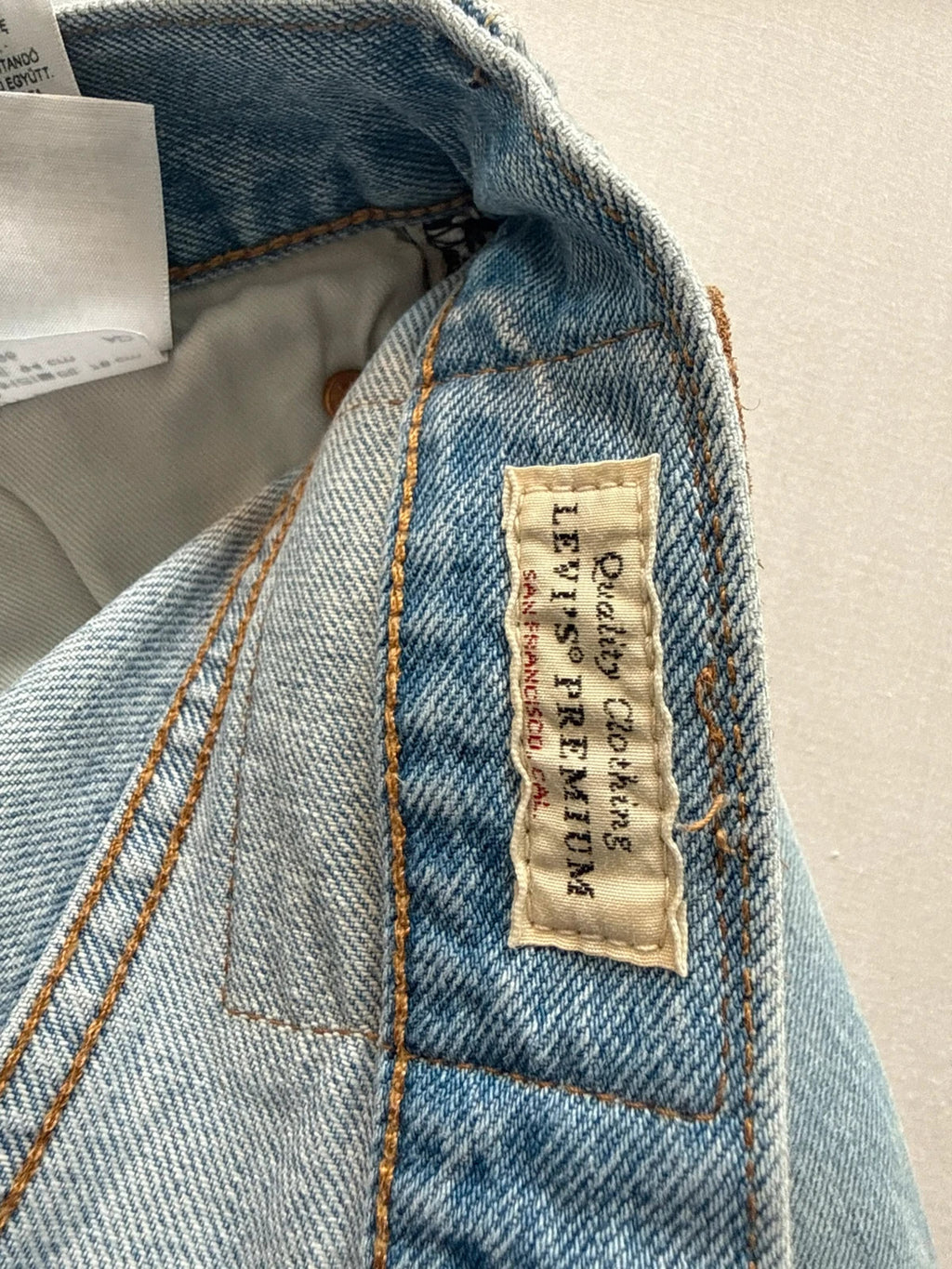 Levi's light blue straight jeans with button fly and signature back pocket stitching.