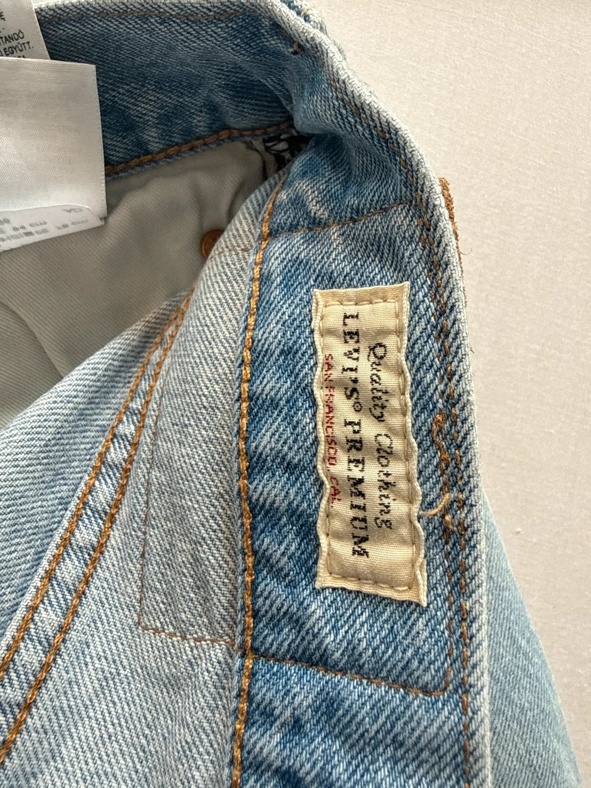 Levi's light blue straight jeans with button fly and signature back pocket stitching.