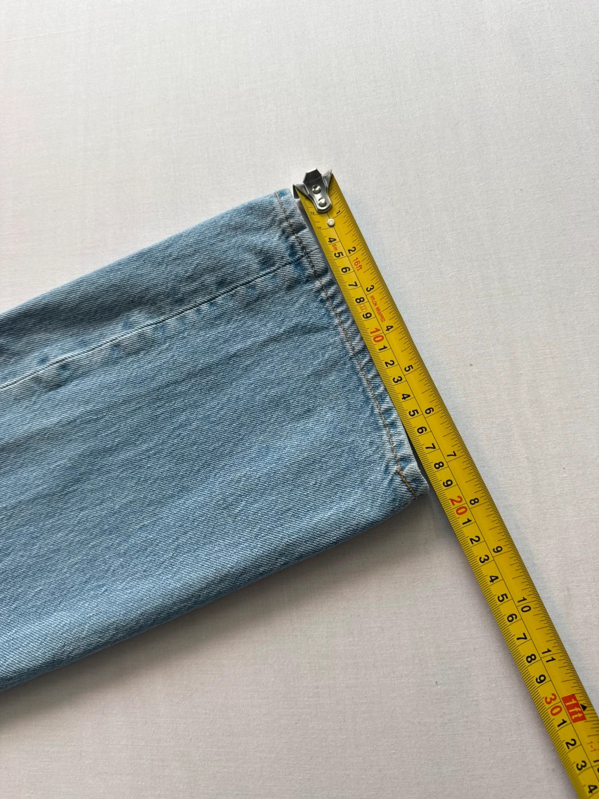 Levi's light blue straight jeans with button fly and signature back pocket stitching.