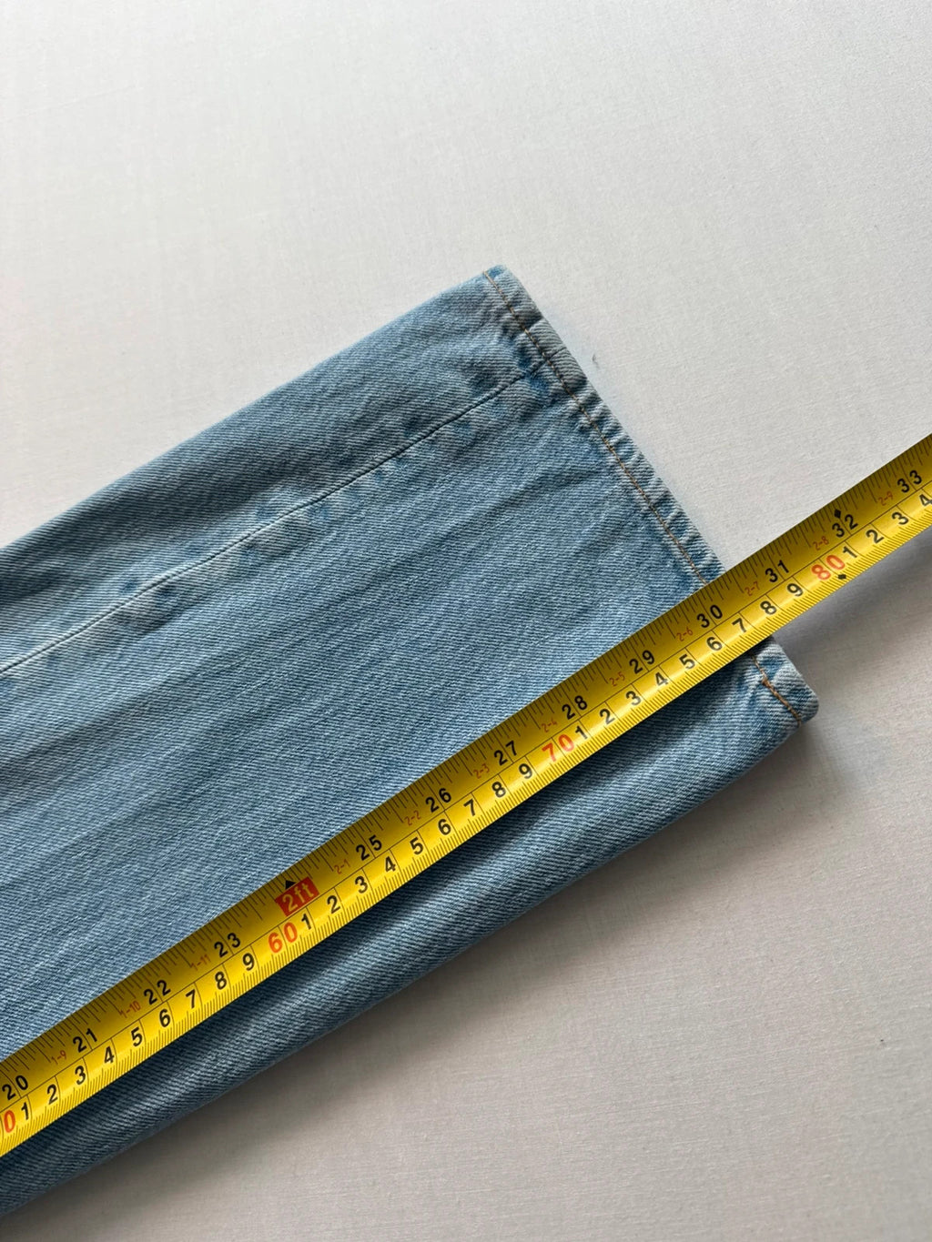 Levi's light blue straight jeans with button fly and signature back pocket stitching.