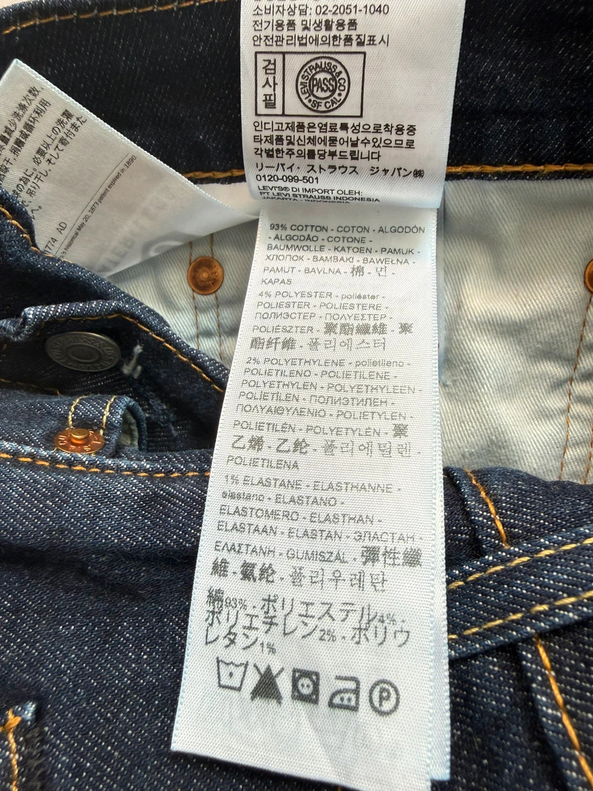 Levi's dark indigo slim taper jeans with classic five-pocket styling and signature stitching.