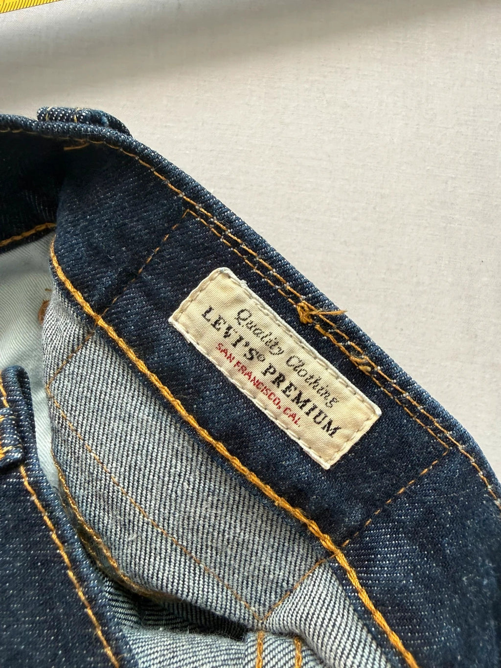 Levi's dark indigo slim taper jeans with classic five-pocket styling and signature stitching.