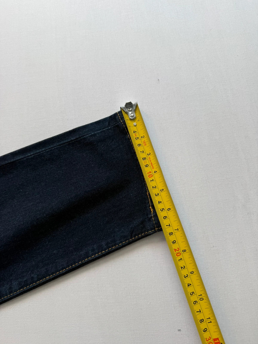 Levi's dark indigo slim taper jeans with classic five-pocket styling and signature stitching.