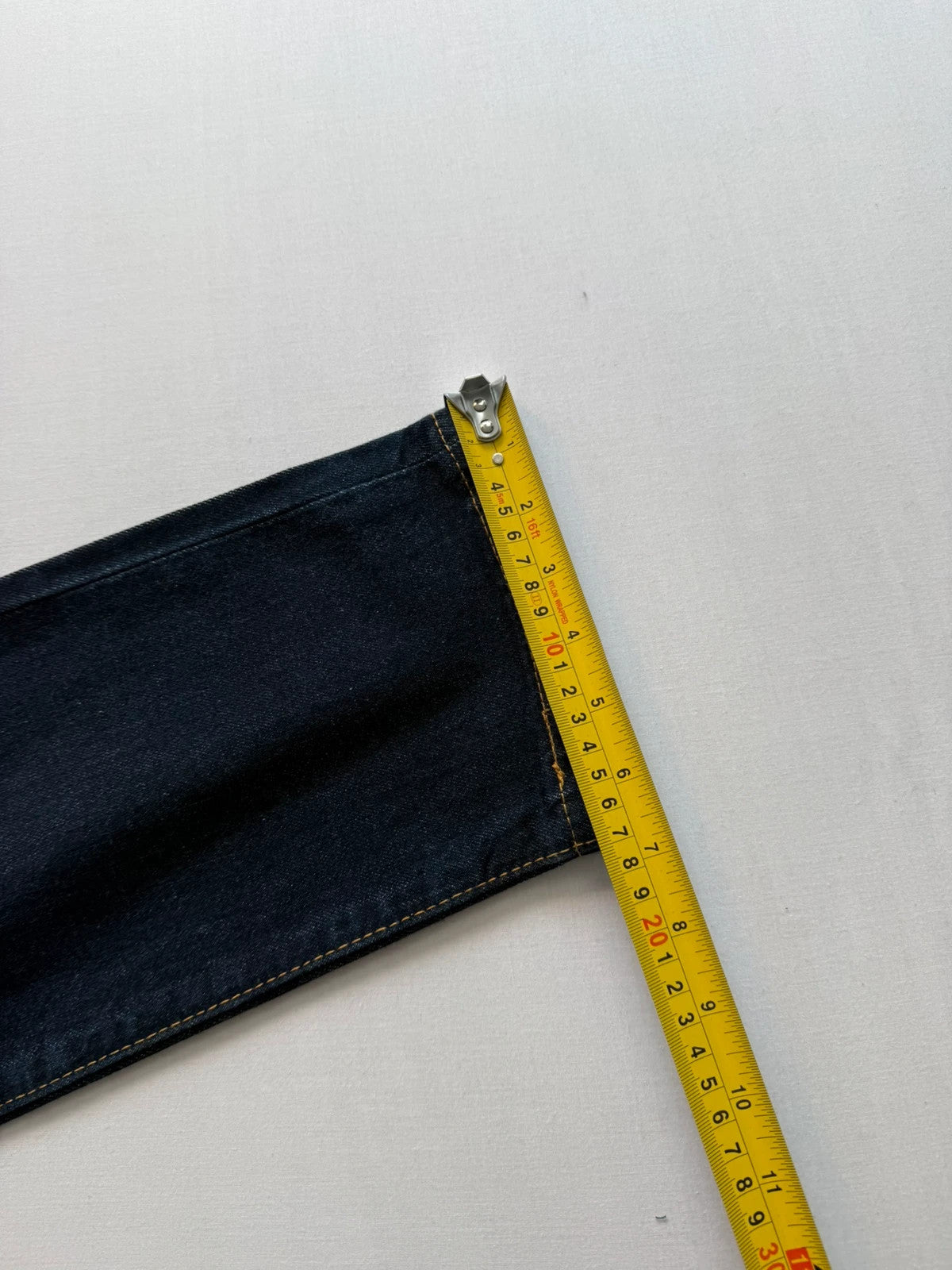 Levi's dark indigo slim taper jeans with classic five-pocket styling and signature stitching.