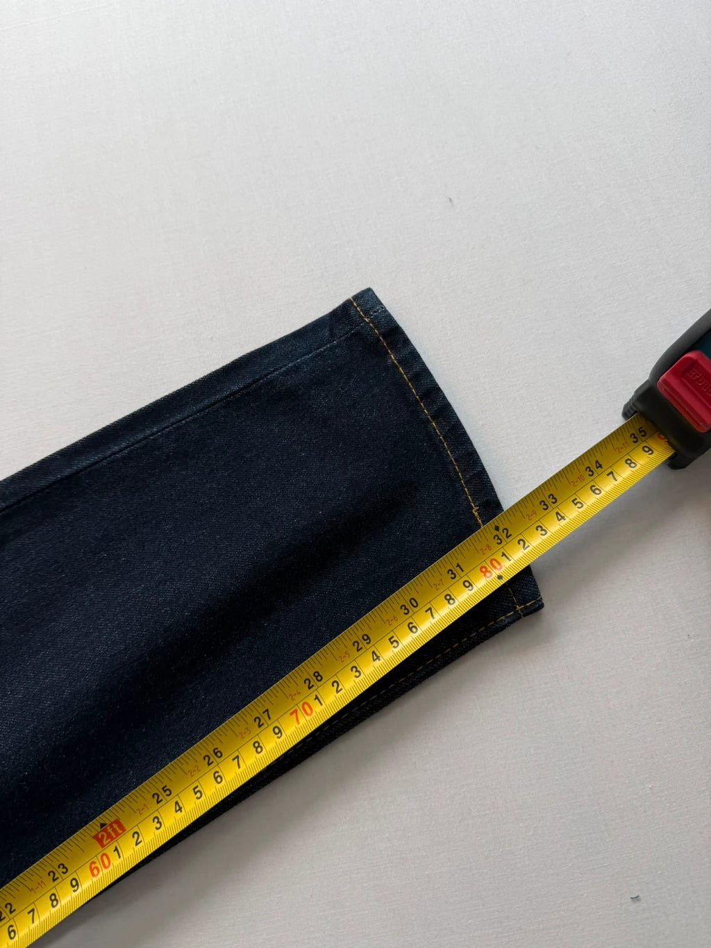 Levi's dark indigo slim taper jeans with classic five-pocket styling and signature stitching.