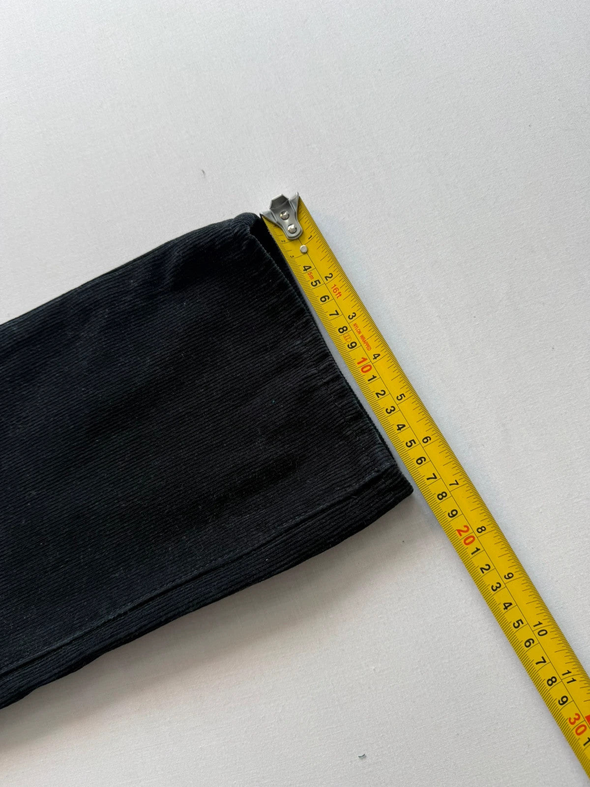 Levi's black straight jeans with classic five-pocket styling and signature back pocket stitching.