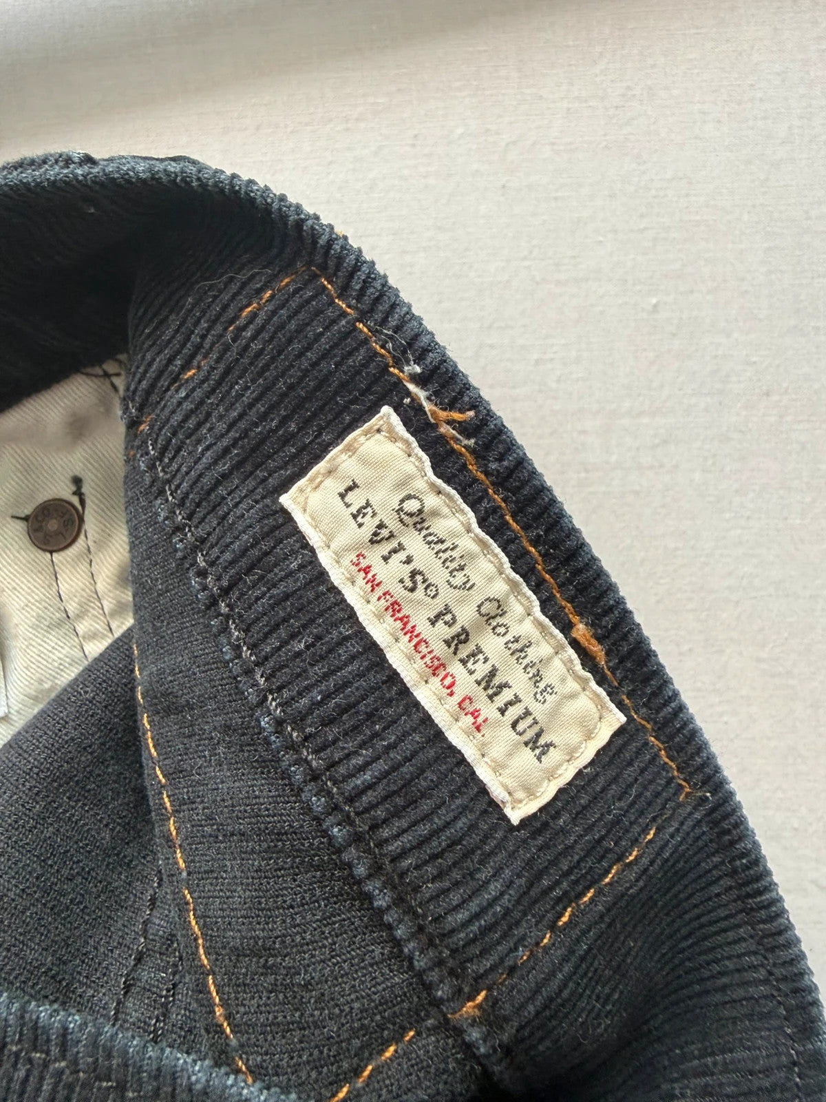 Levi's black straight jeans with classic five-pocket styling and signature back pocket stitching.