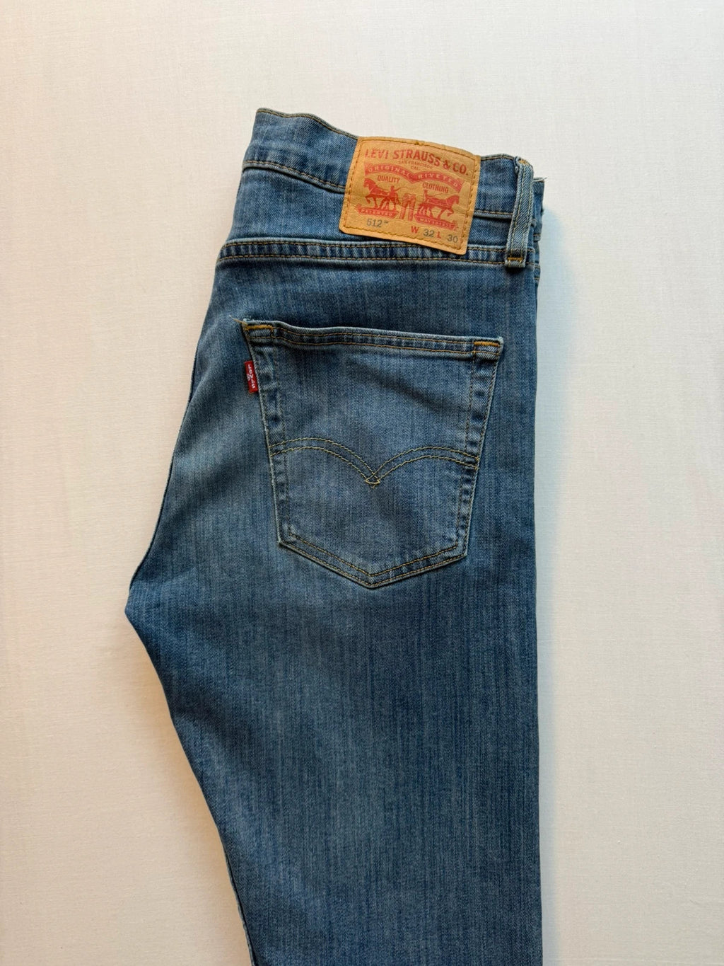 Levi's blue straight jeans with classic five-pocket styling and tapered leg.