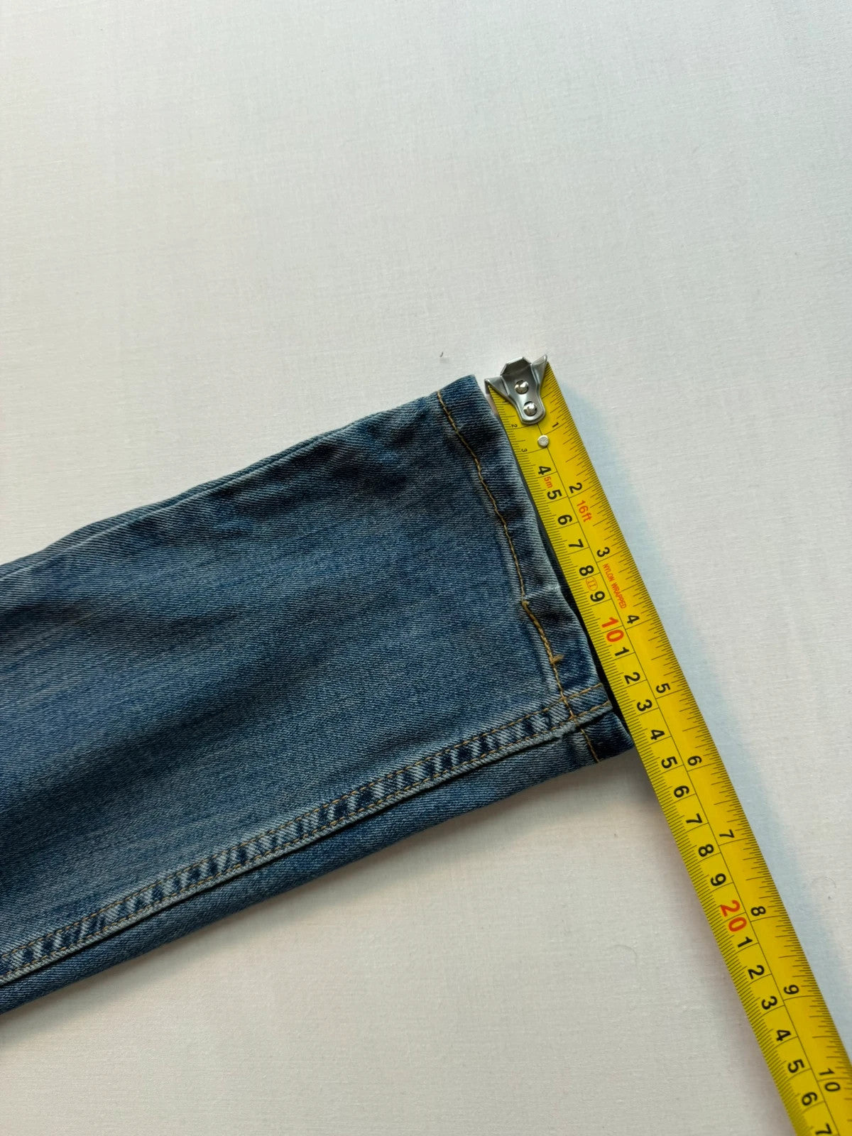 Levi's blue straight jeans with classic five-pocket styling and tapered leg.