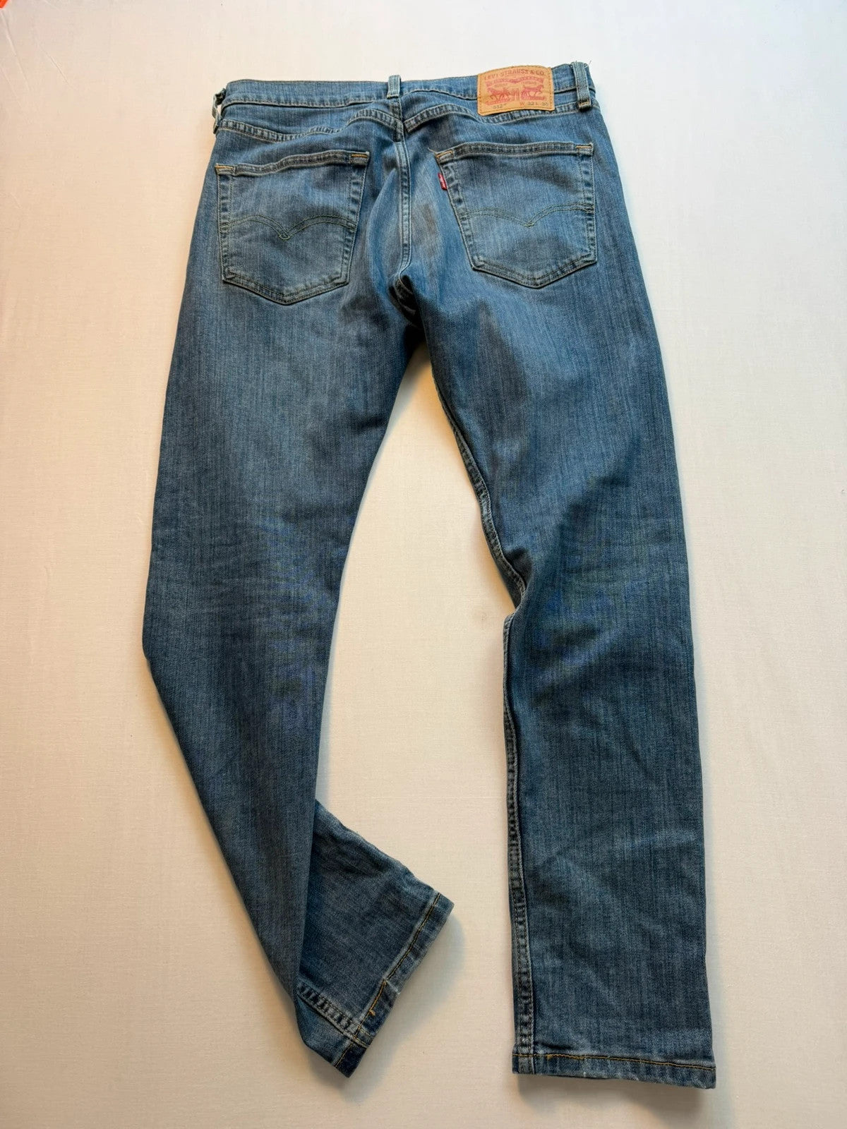 Levi's blue straight jeans with classic five-pocket styling and tapered leg.