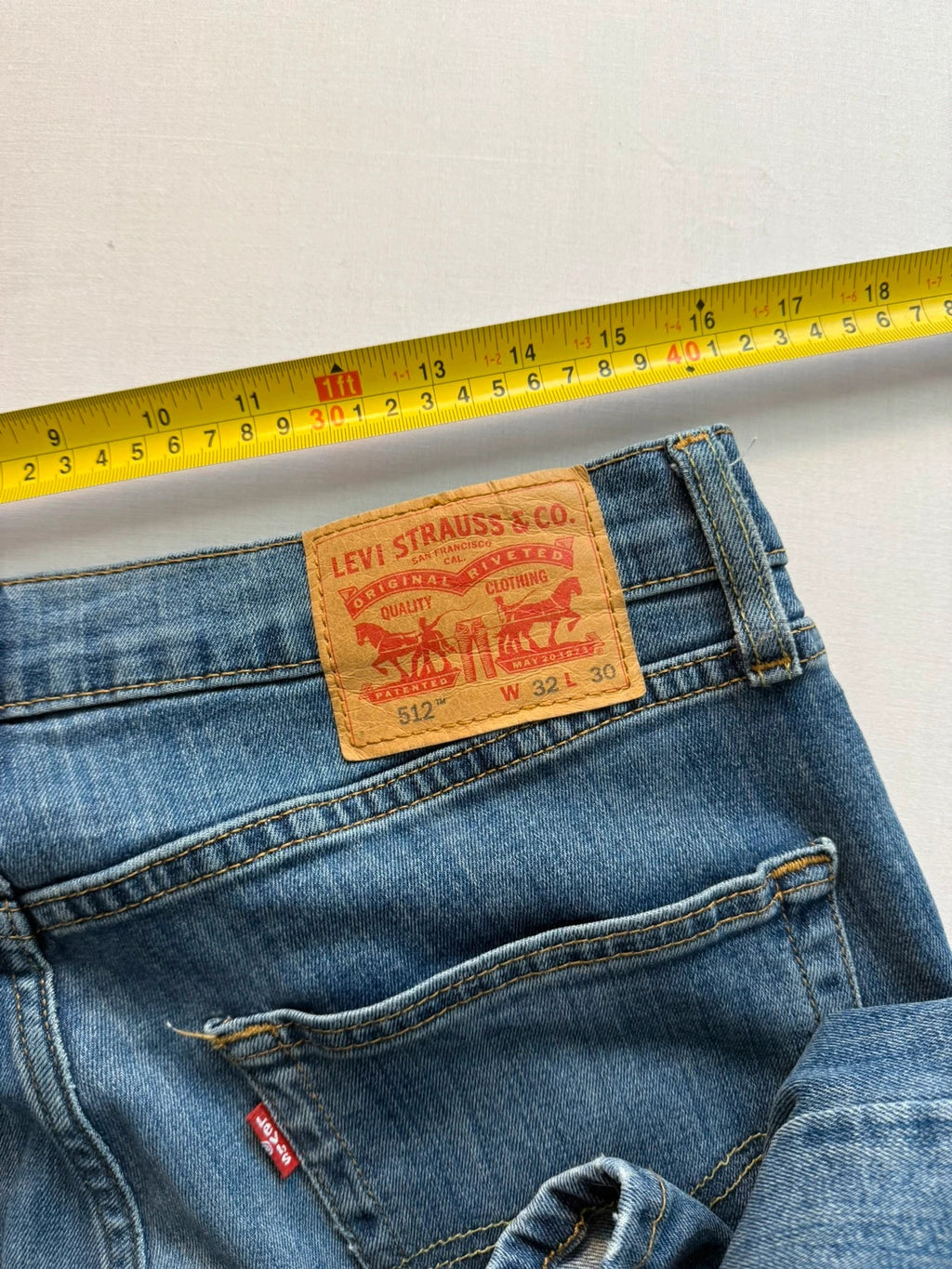 Levi's blue straight jeans with classic five-pocket styling and tapered leg.