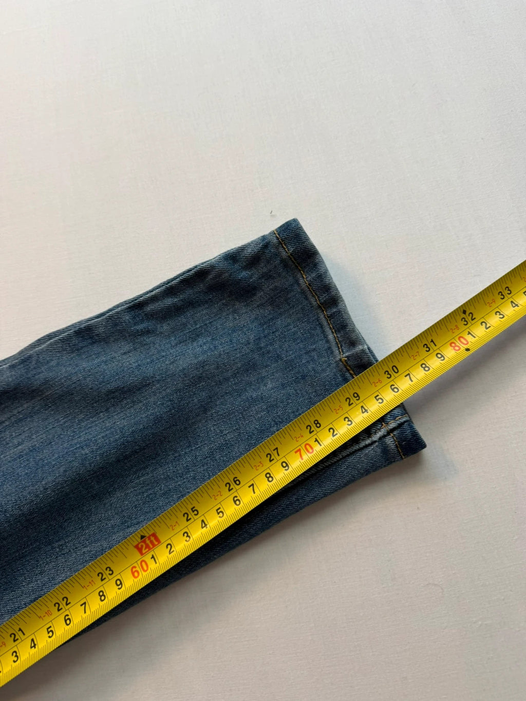 Levi's blue straight jeans with classic five-pocket styling and tapered leg.