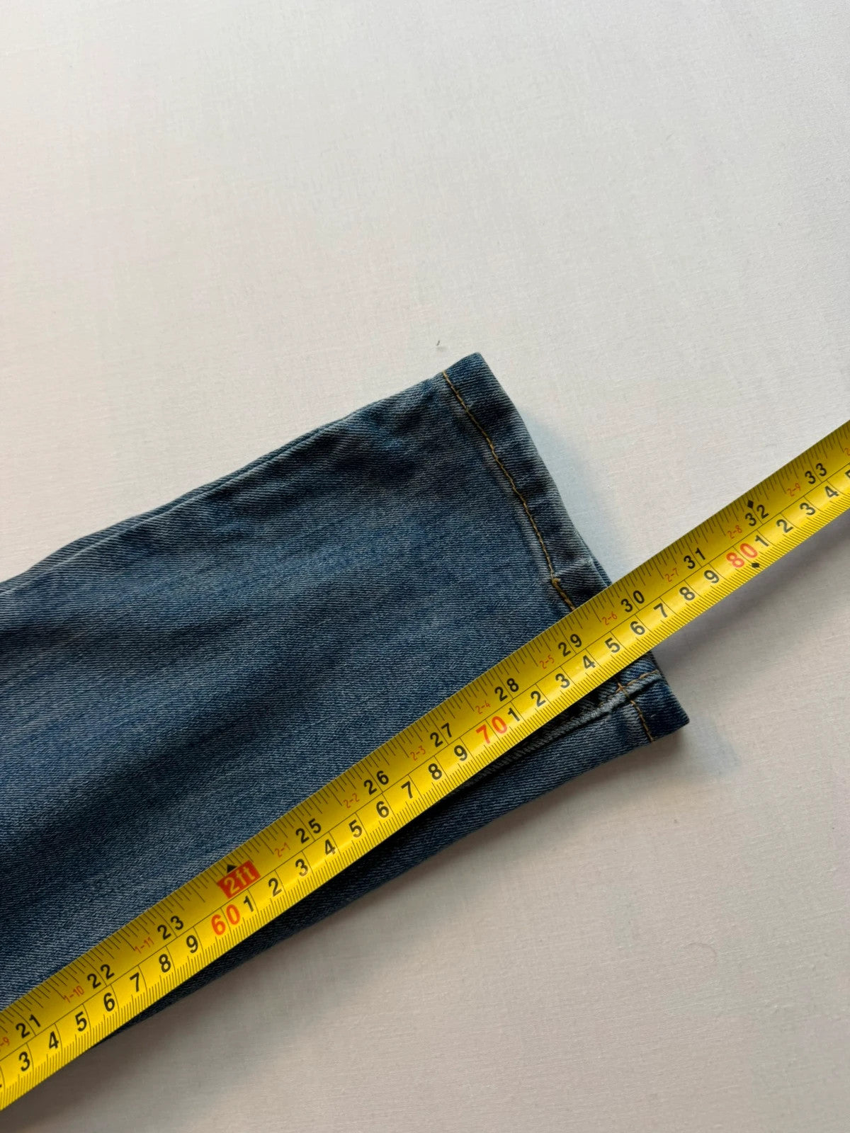 Levi's blue straight jeans with classic five-pocket styling and tapered leg.