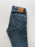 Levi's blue tapered jeans with classic 501 cut and subtle stretch detail.