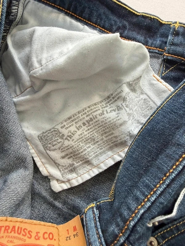 Levi's blue straight jeans with original logo patch and slight stretch material.