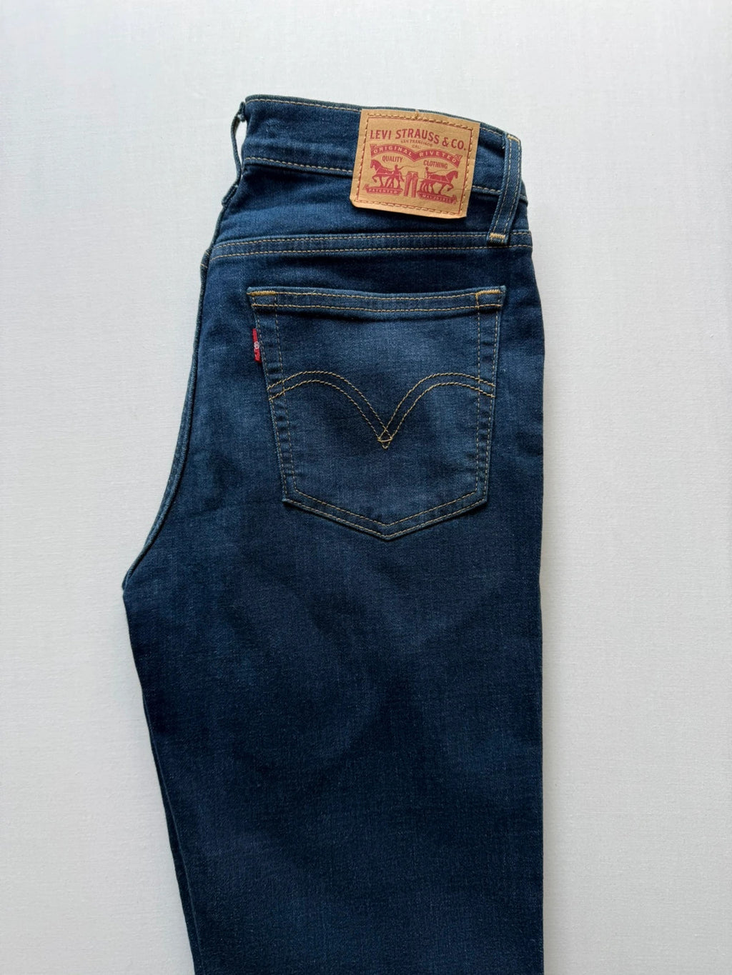 Levi's dark blue boyfriend jeans with classic five-pocket styling and leather patch.