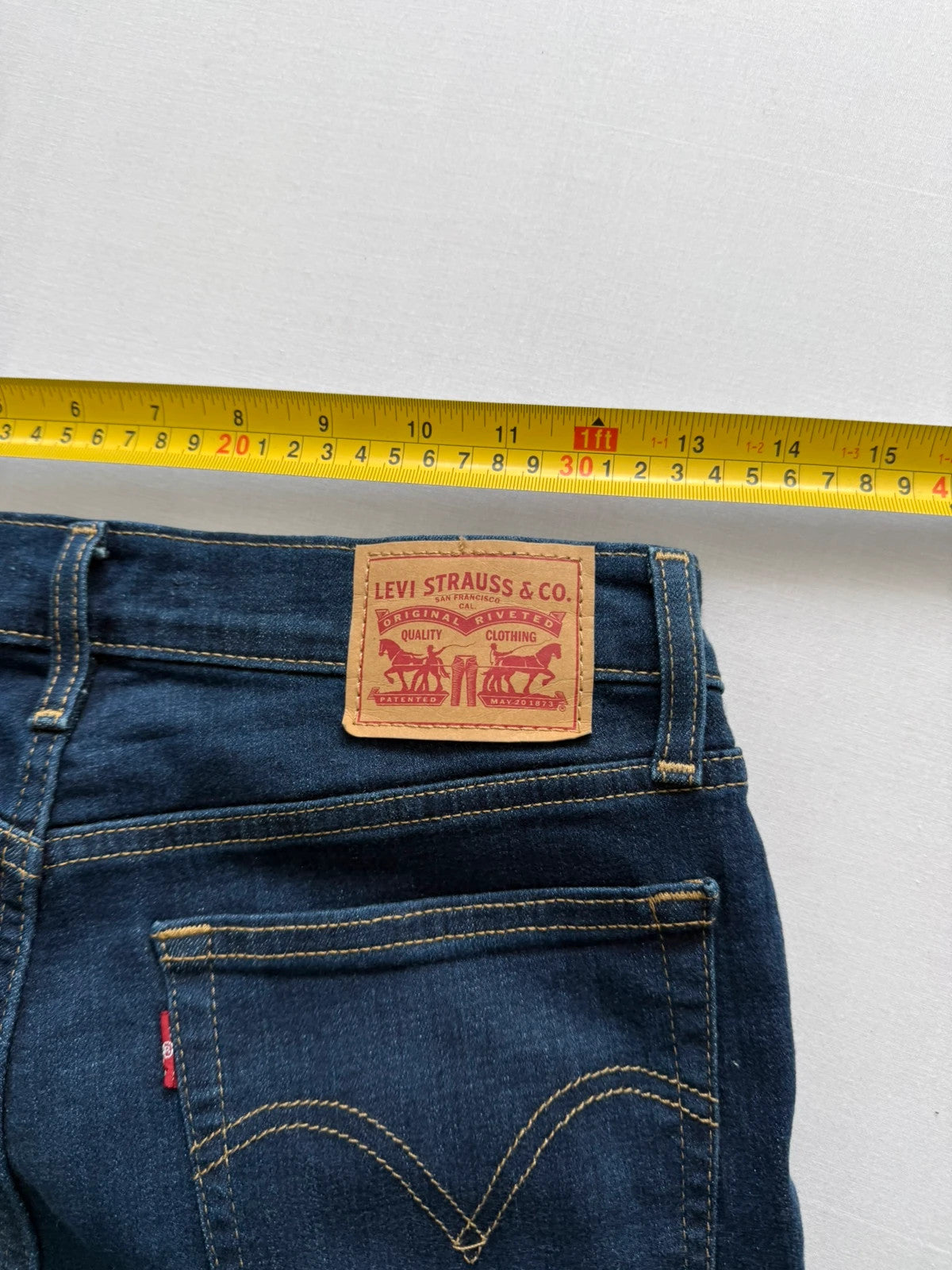 Levi's dark blue boyfriend jeans with classic five-pocket styling and leather patch.