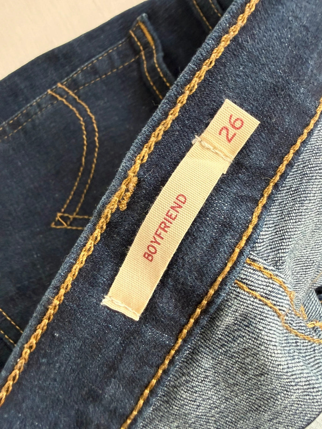 Levi's dark blue boyfriend jeans with classic five-pocket styling and leather patch.