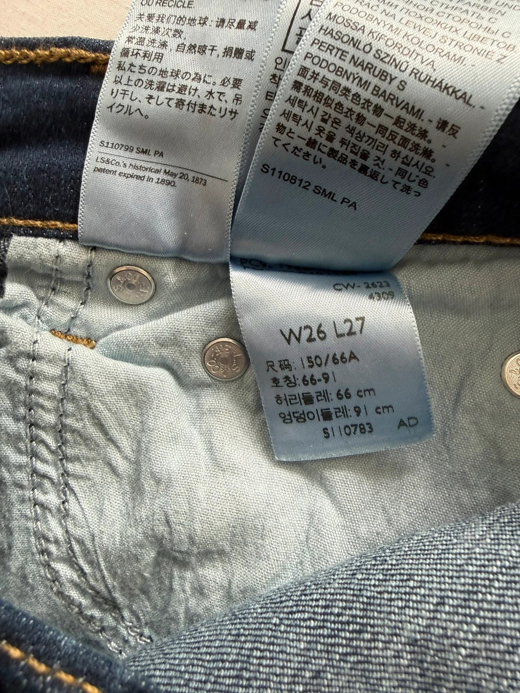 Levi's dark blue boyfriend jeans with classic five-pocket styling and leather patch.