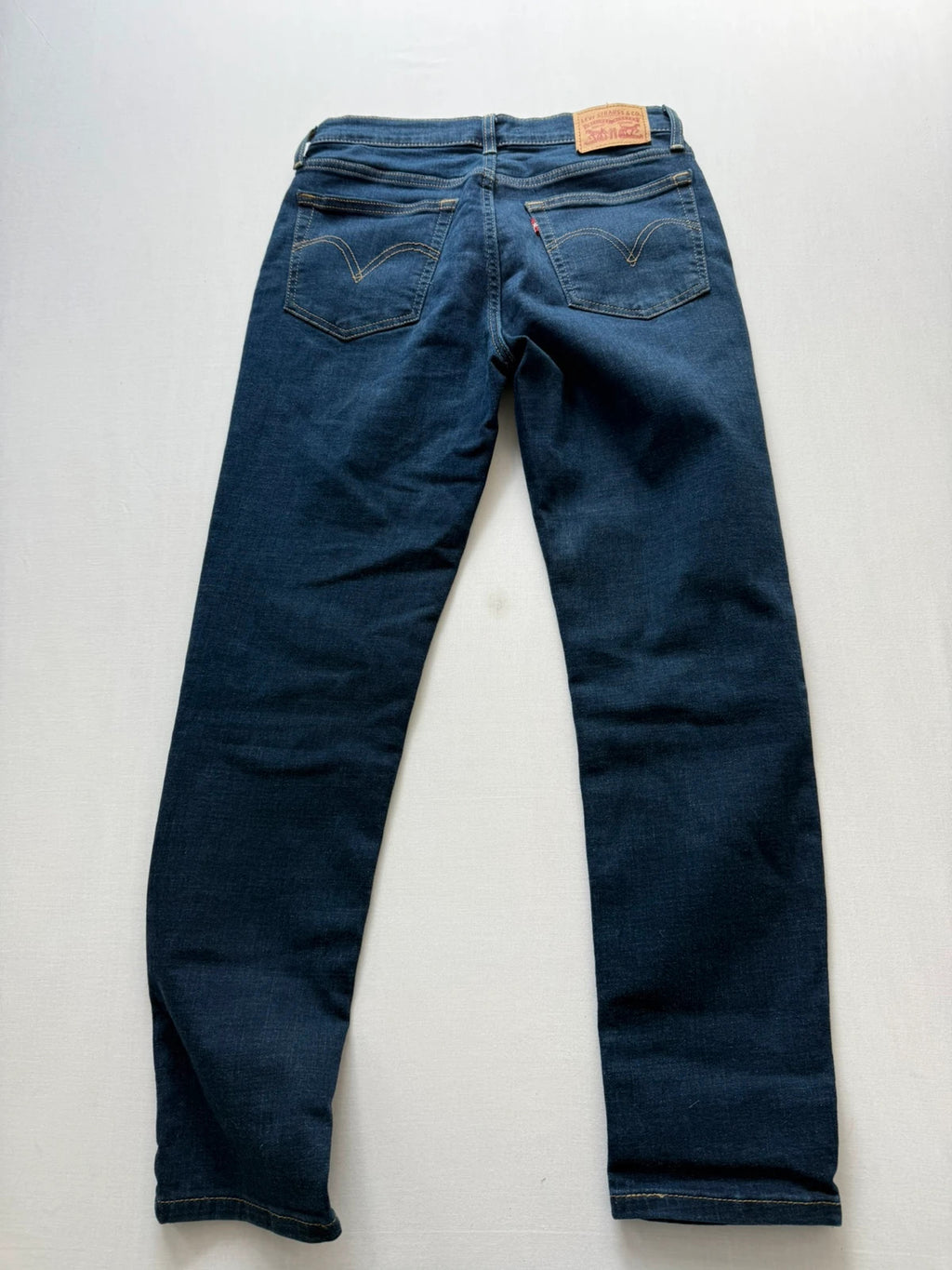 Levi's dark blue boyfriend jeans with classic five-pocket styling and leather patch.