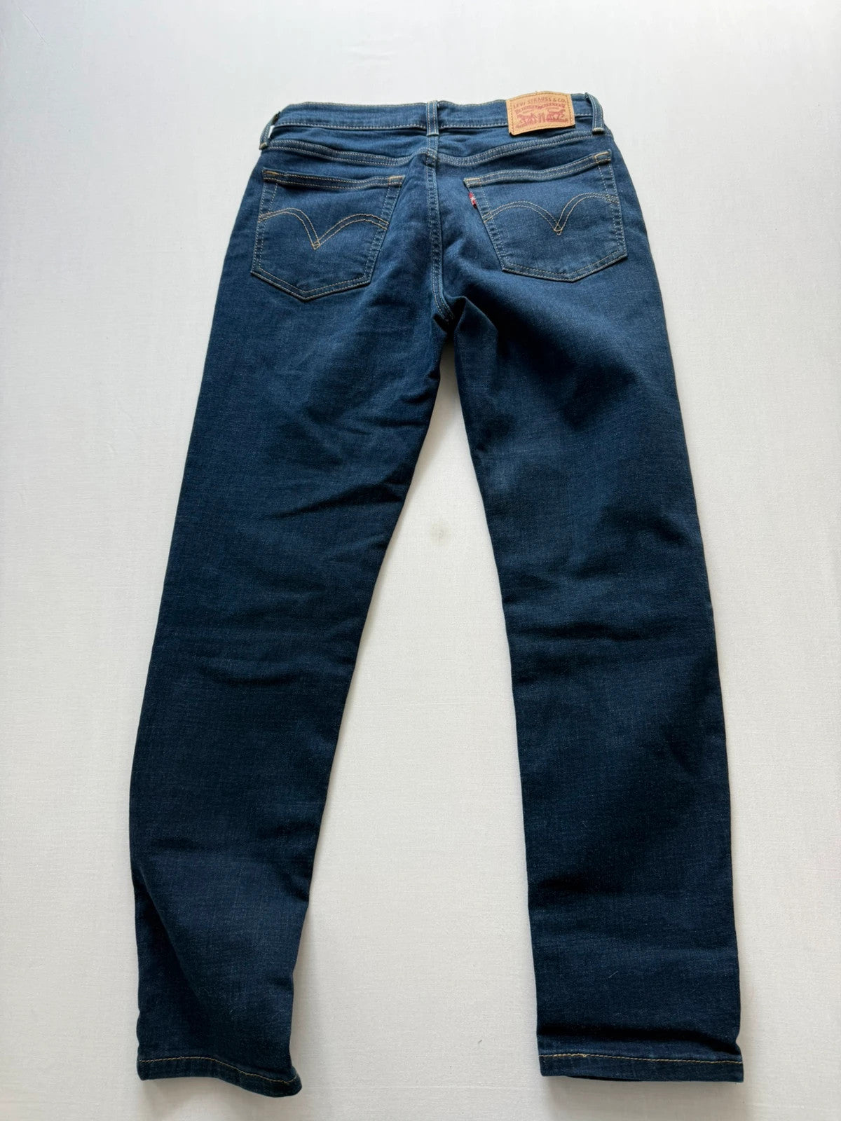 Levi's dark blue boyfriend jeans with classic five-pocket styling and leather patch.