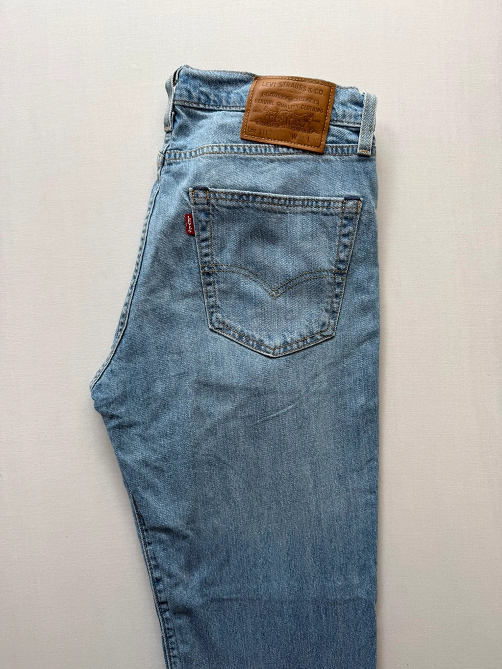 Levi's light blue 511 slim jeans with classic five-pocket styling and leather patch.