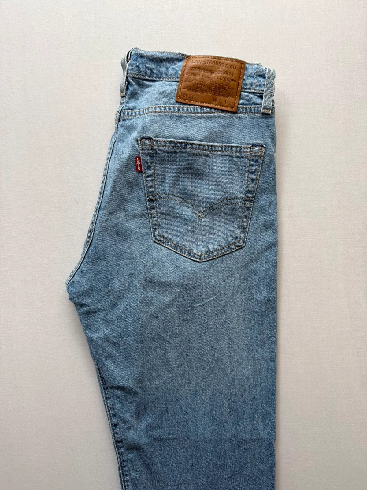 Levi's light blue 511 slim jeans with classic five-pocket styling and leather patch.