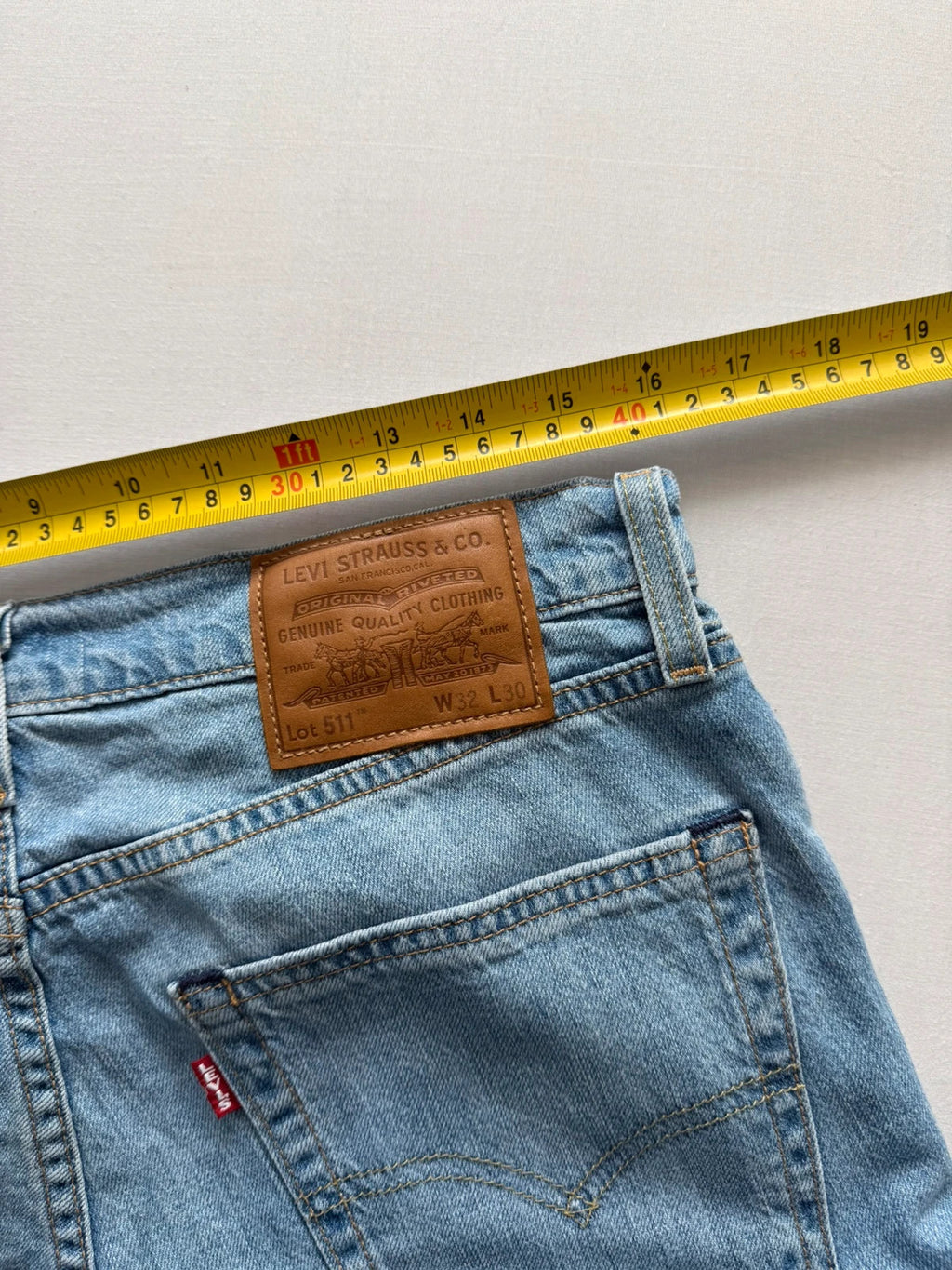 Levi's light blue 511 slim jeans with classic five-pocket styling and leather patch.