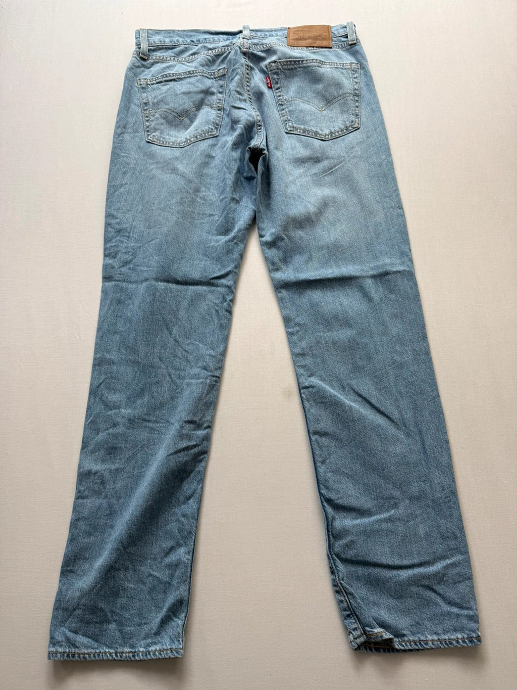 Levi's light blue 511 slim jeans with classic five-pocket styling and leather patch.