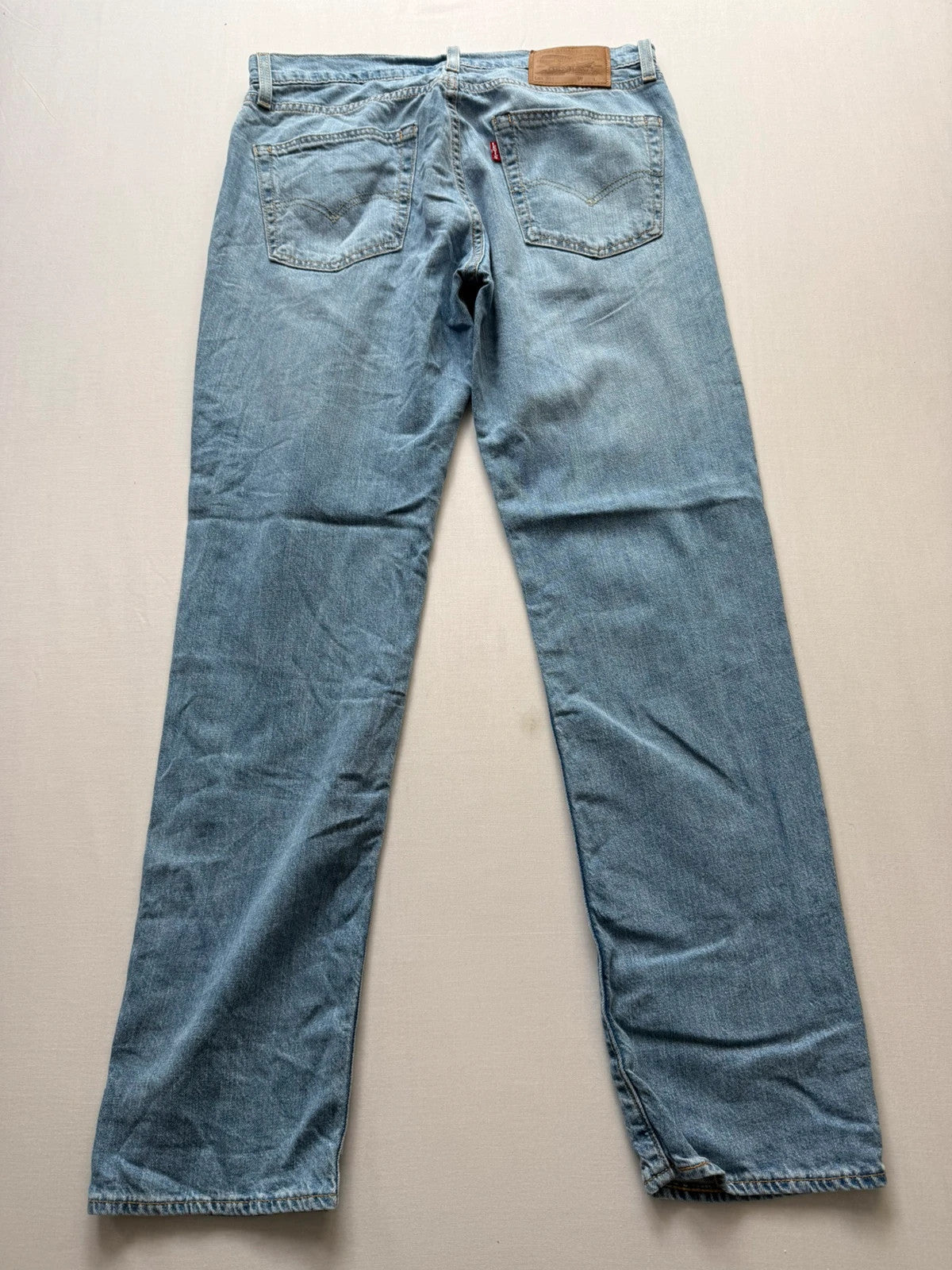 Levi's light blue 511 slim jeans with classic five-pocket styling and leather patch.