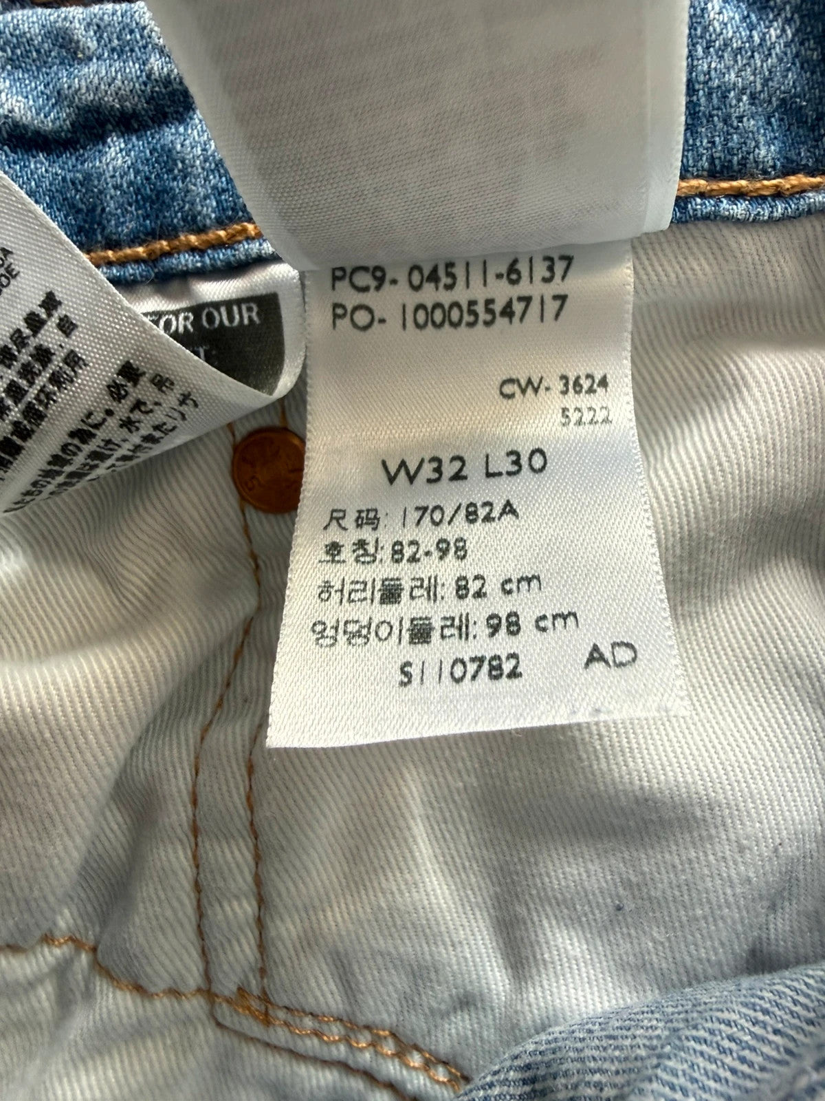 Levi's light blue 511 slim jeans with classic five-pocket styling and leather patch.
