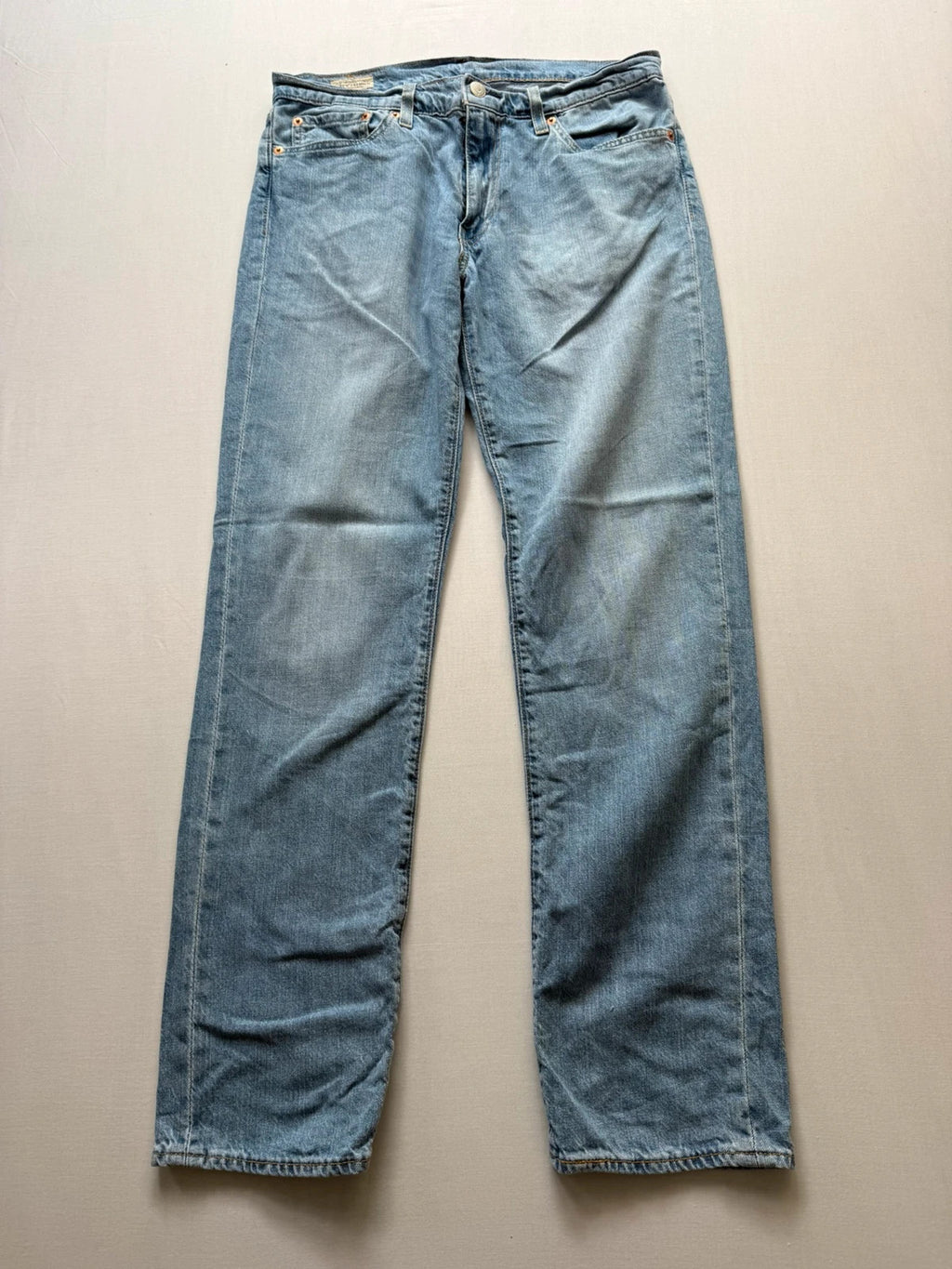Levi's light blue 511 slim jeans with classic five-pocket styling and leather patch.