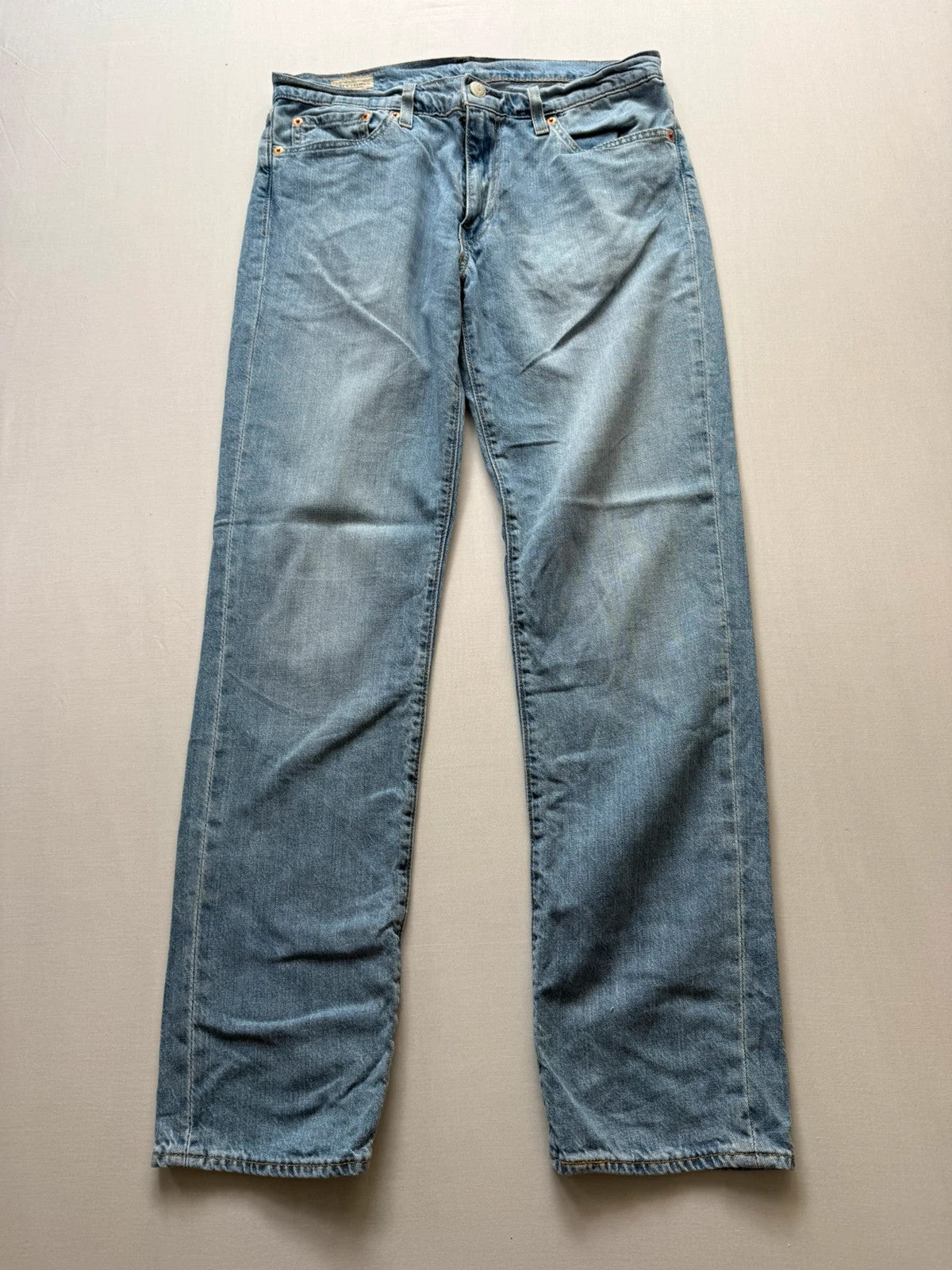 Levi's light blue 511 slim jeans with classic five-pocket styling and leather patch.