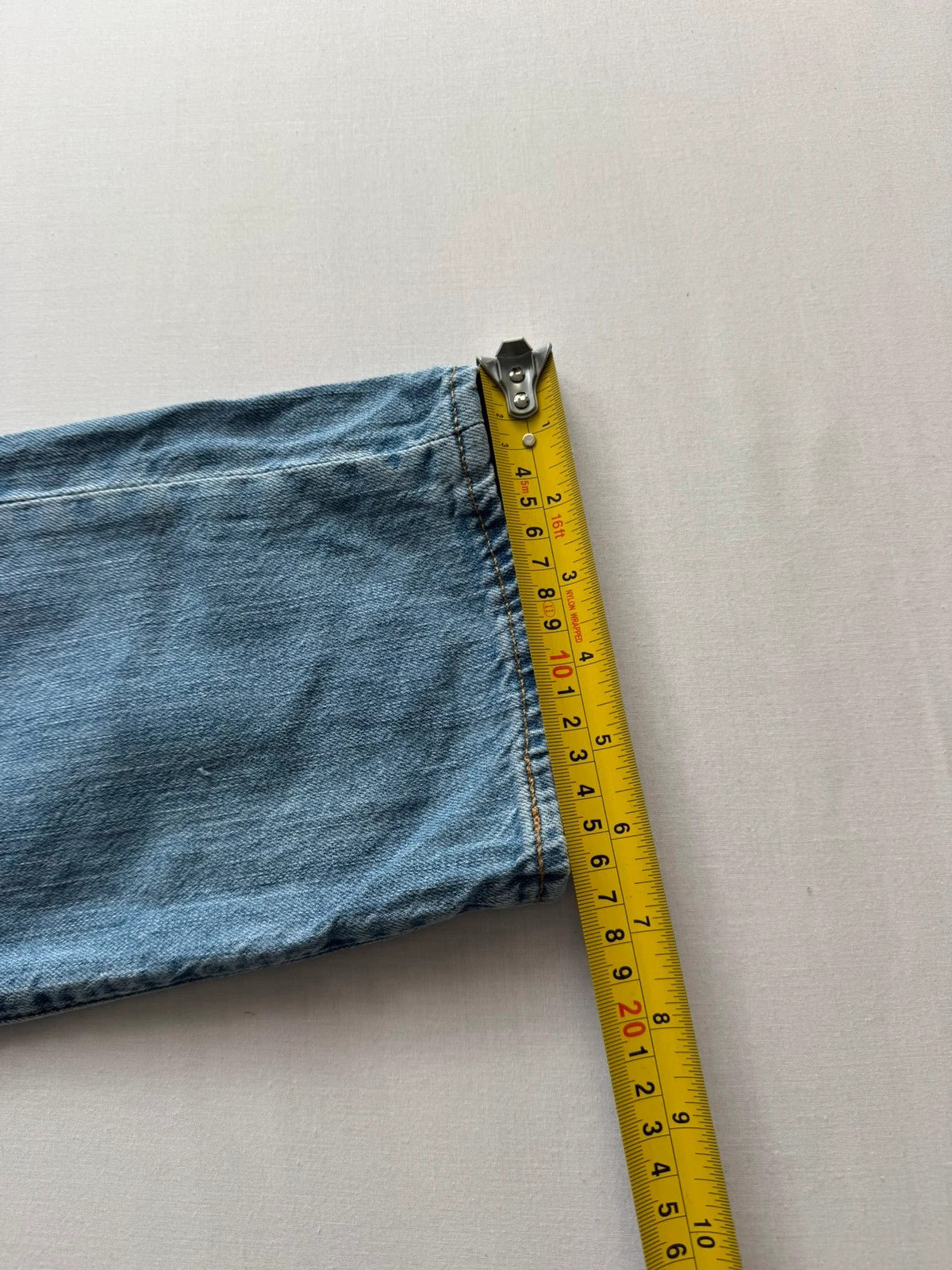 Levi's light blue 511 slim jeans with classic five-pocket styling and leather patch.