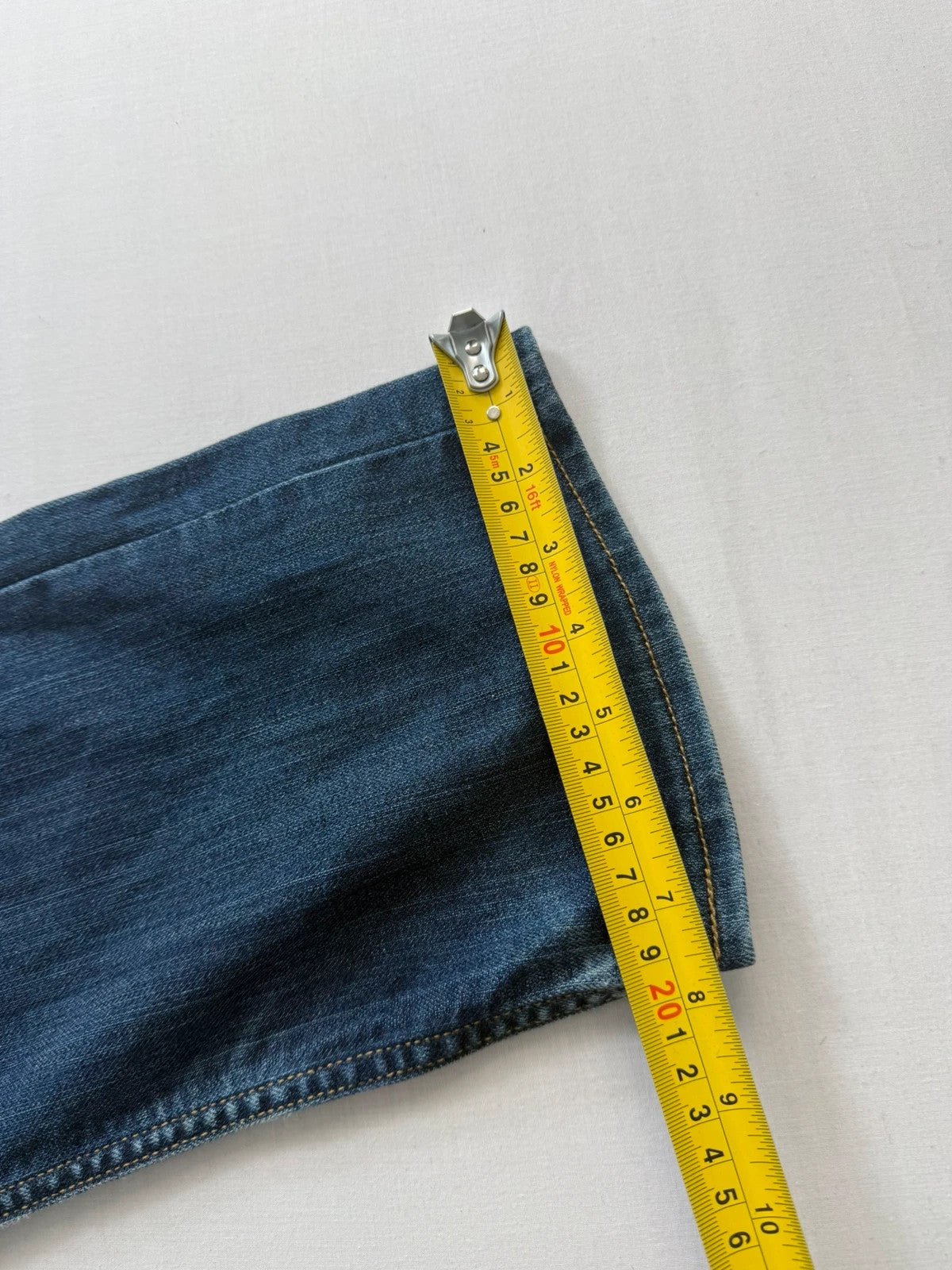 Levi's blue straight jeans with classic 5-pocket styling and signature back stitching.