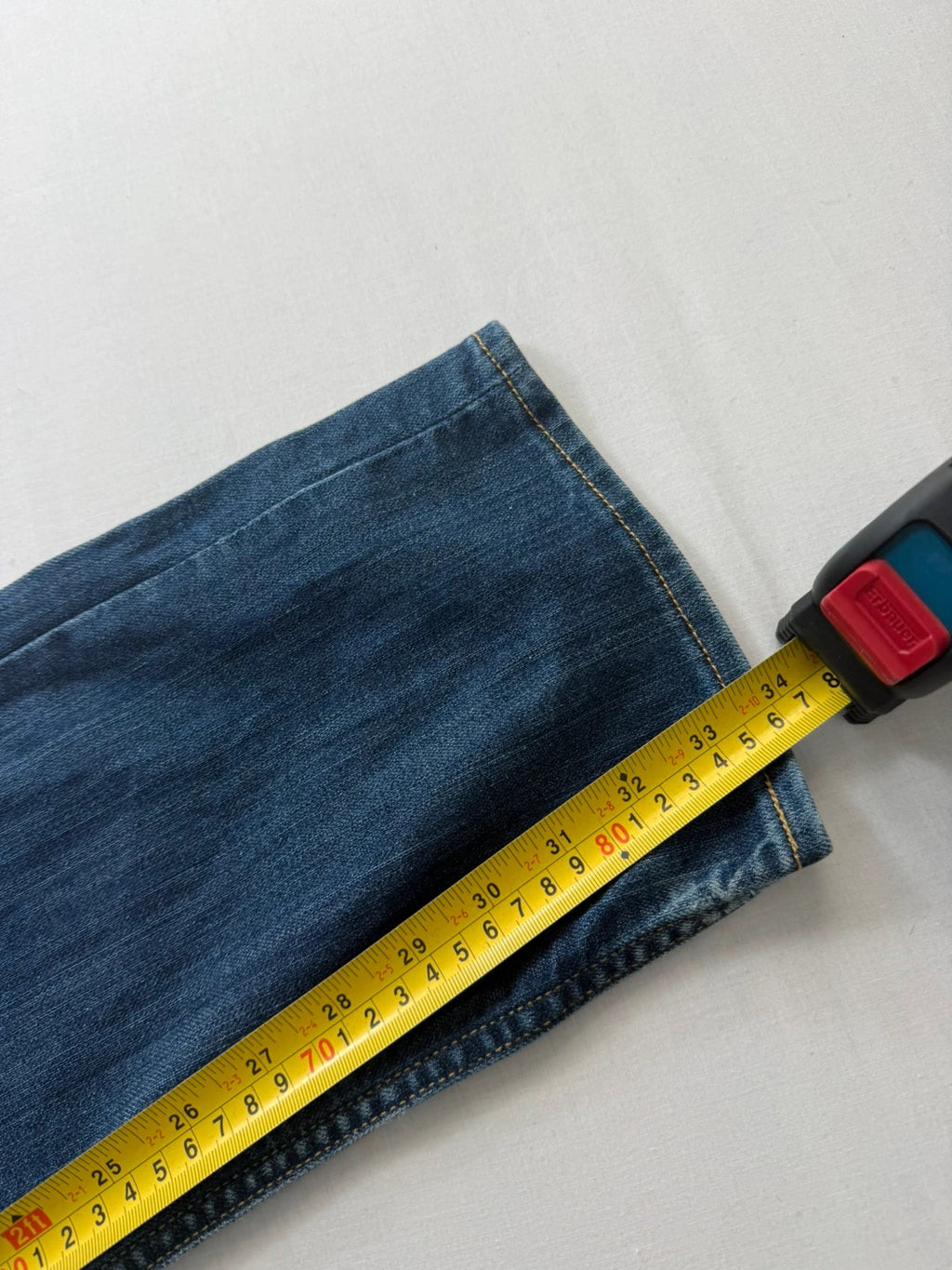 Levi's blue straight jeans with classic 5-pocket styling and signature back stitching.