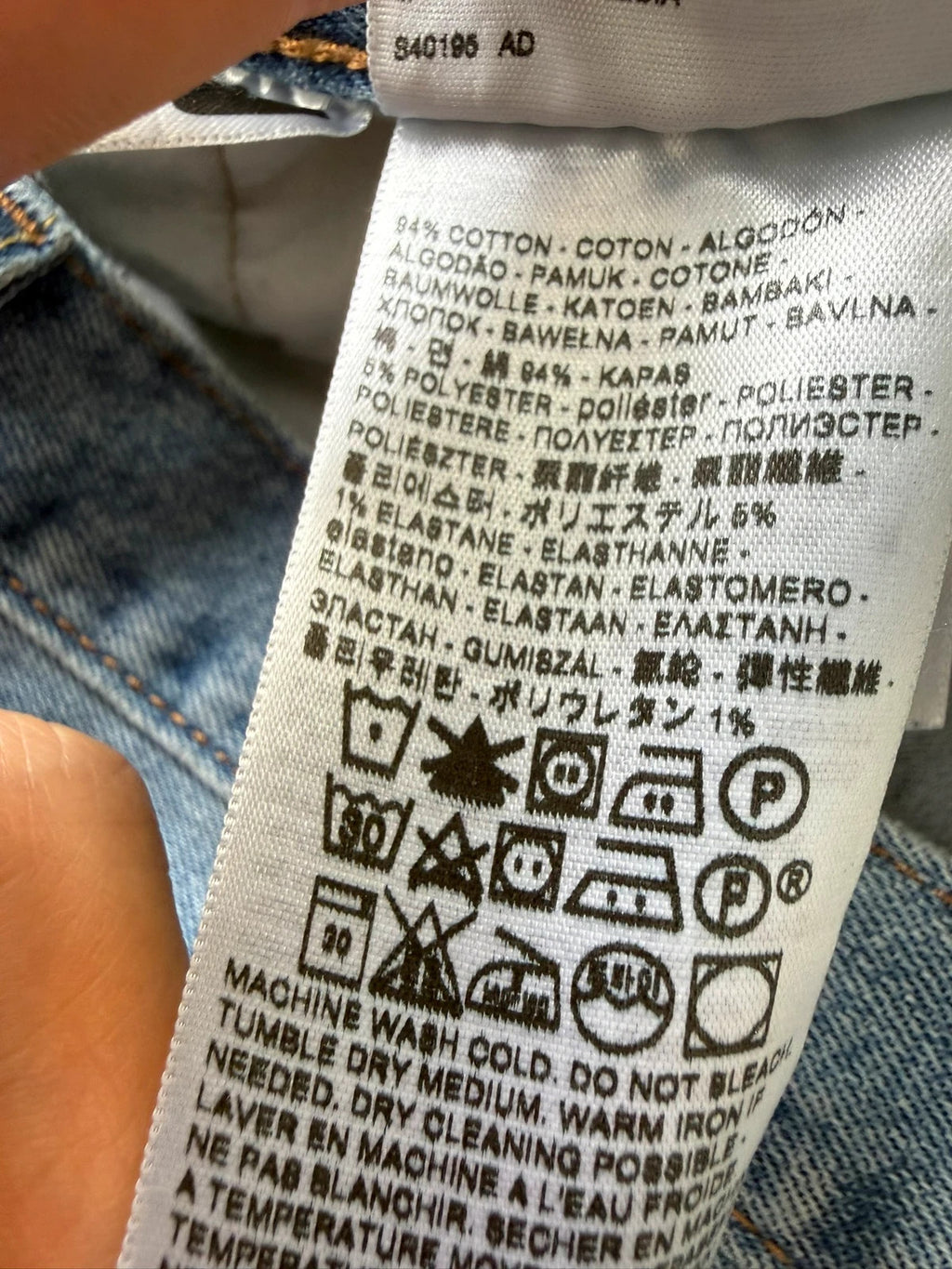 Levi's blue straight jeans with natural fading, 5-pocket styling, and back arcuate stitching.