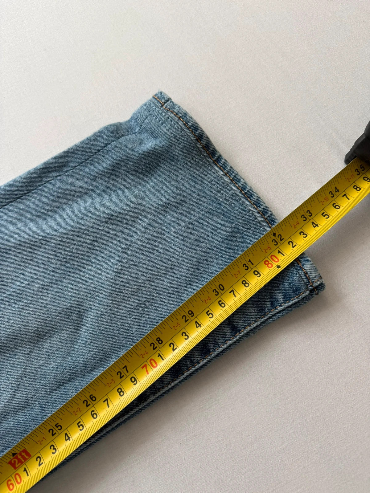 Levi's blue straight jeans with natural fading, 5-pocket styling, and back arcuate stitching.