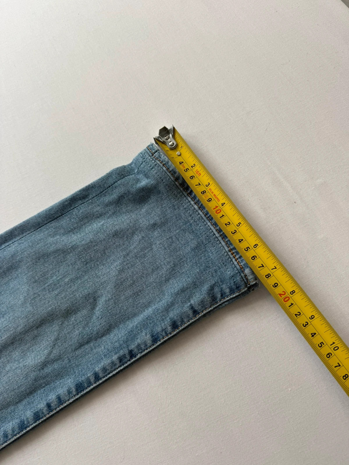 Levi's blue straight jeans with natural fading, 5-pocket styling, and back arcuate stitching.