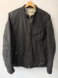 Barbour black waxed cotton biker jacket with embroidered Team Barbour patch and American flag lining.