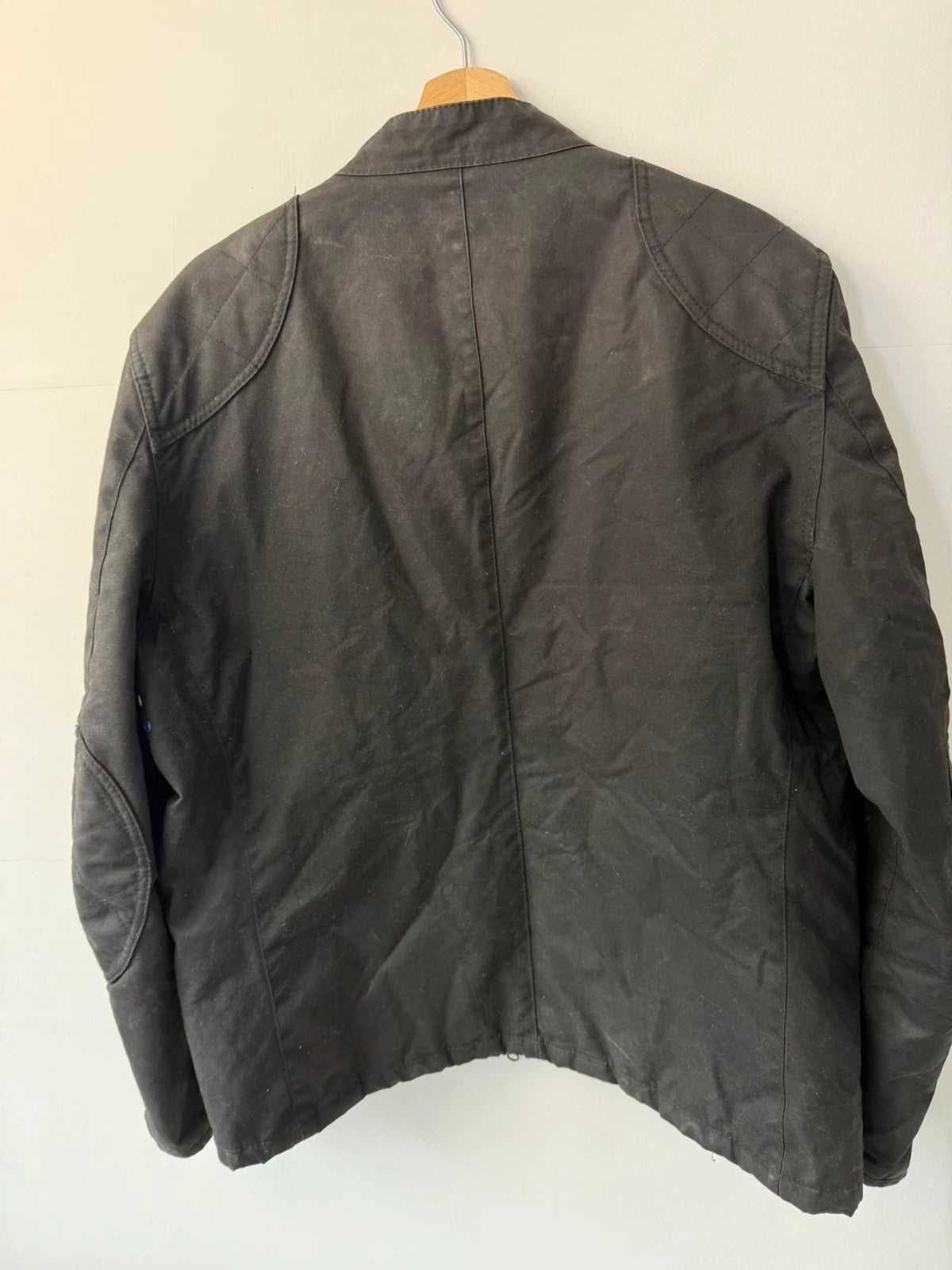 Barbour black waxed cotton biker jacket with embroidered Team Barbour patch and American flag lining.