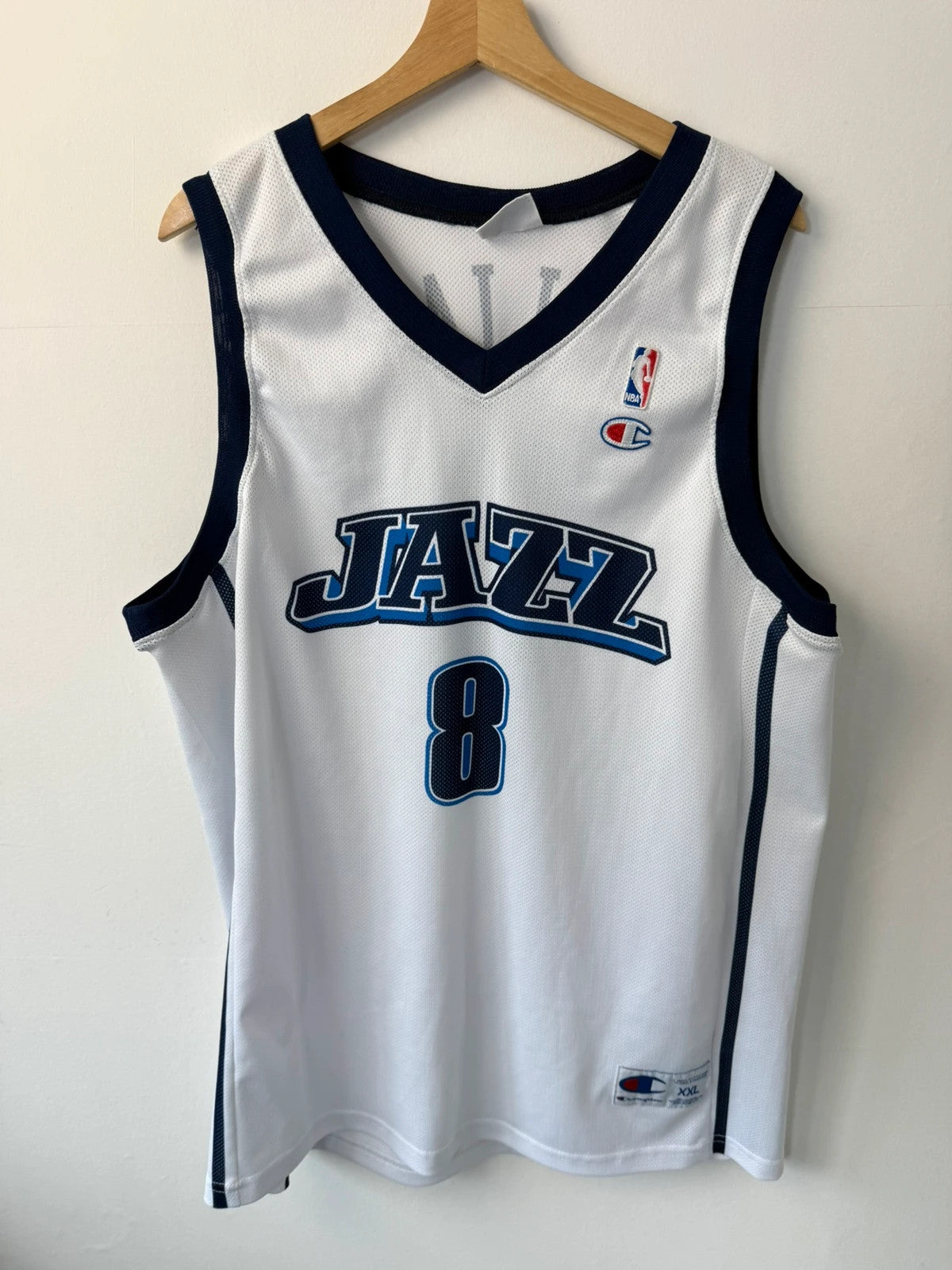 Champion graphic tee blue and white, embroidered NBA logo, mesh fabric, sleeveless cut.