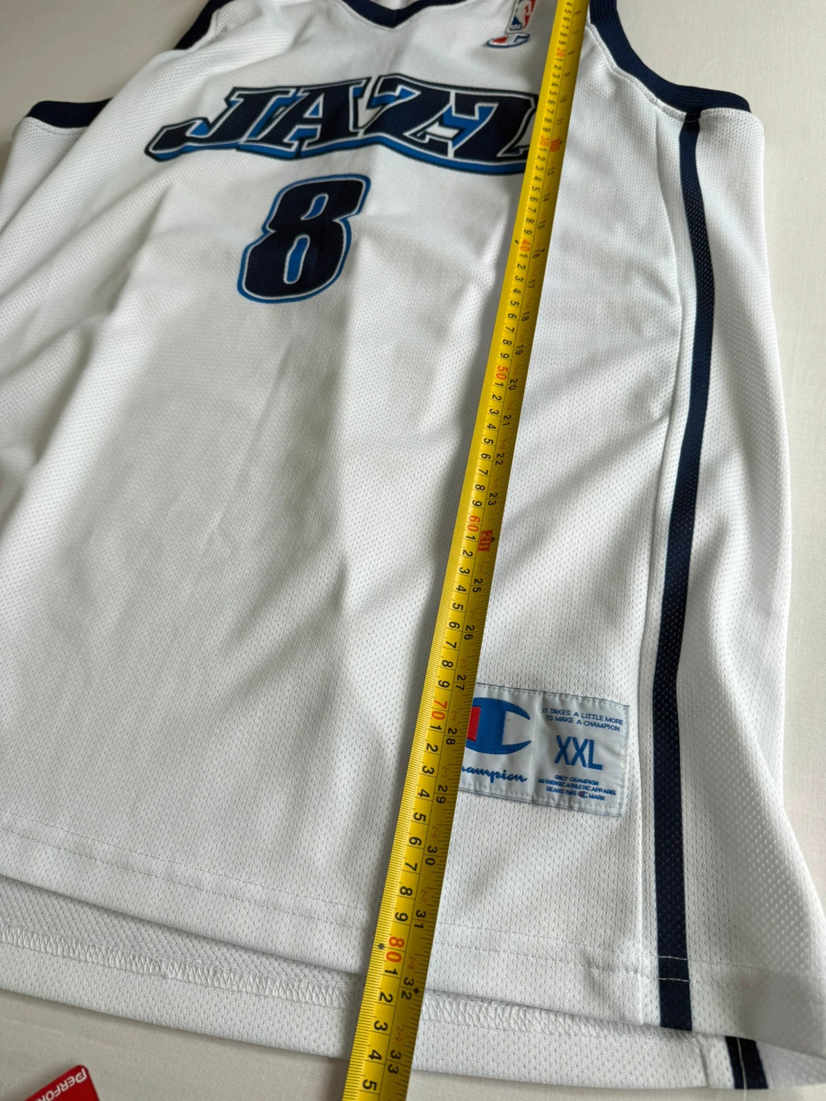 Champion graphic tee blue and white, embroidered NBA logo, mesh fabric, sleeveless cut.