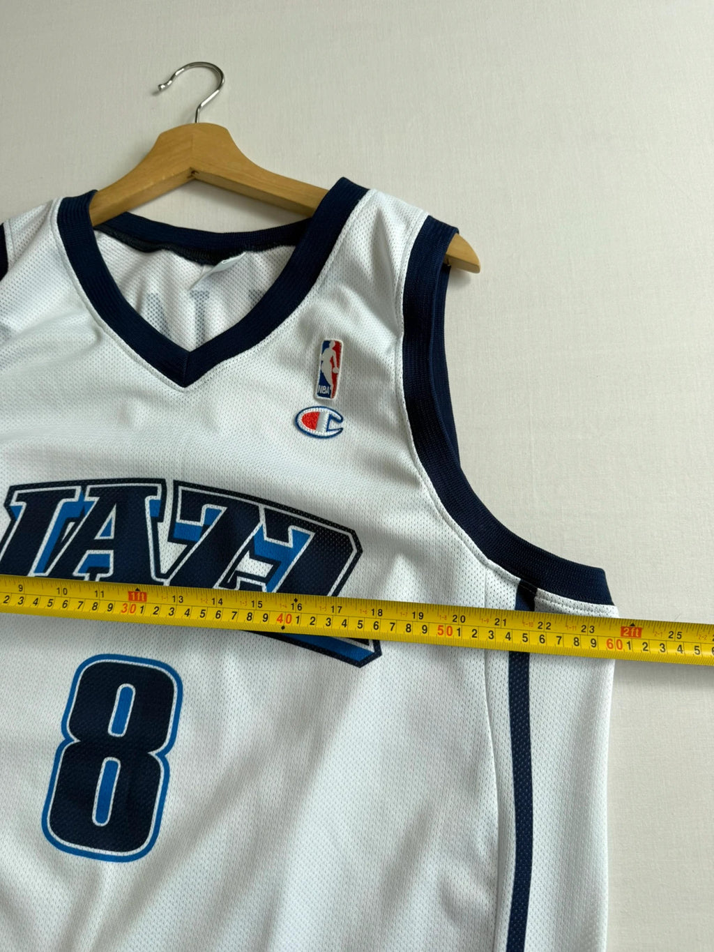 Champion graphic tee blue and white, embroidered NBA logo, mesh fabric, sleeveless cut.