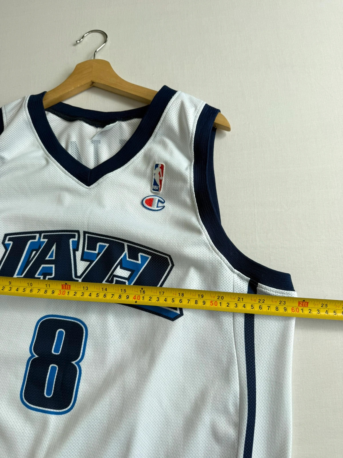 Champion graphic tee blue and white, embroidered NBA logo, mesh fabric, sleeveless cut.