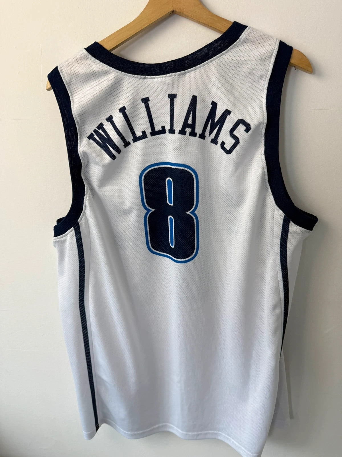 Champion graphic tee blue and white, embroidered NBA logo, mesh fabric, sleeveless cut.