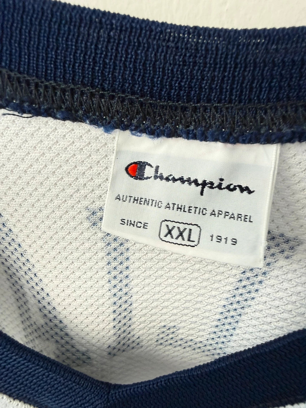 Champion graphic tee blue and white, embroidered NBA logo, mesh fabric, sleeveless cut.
